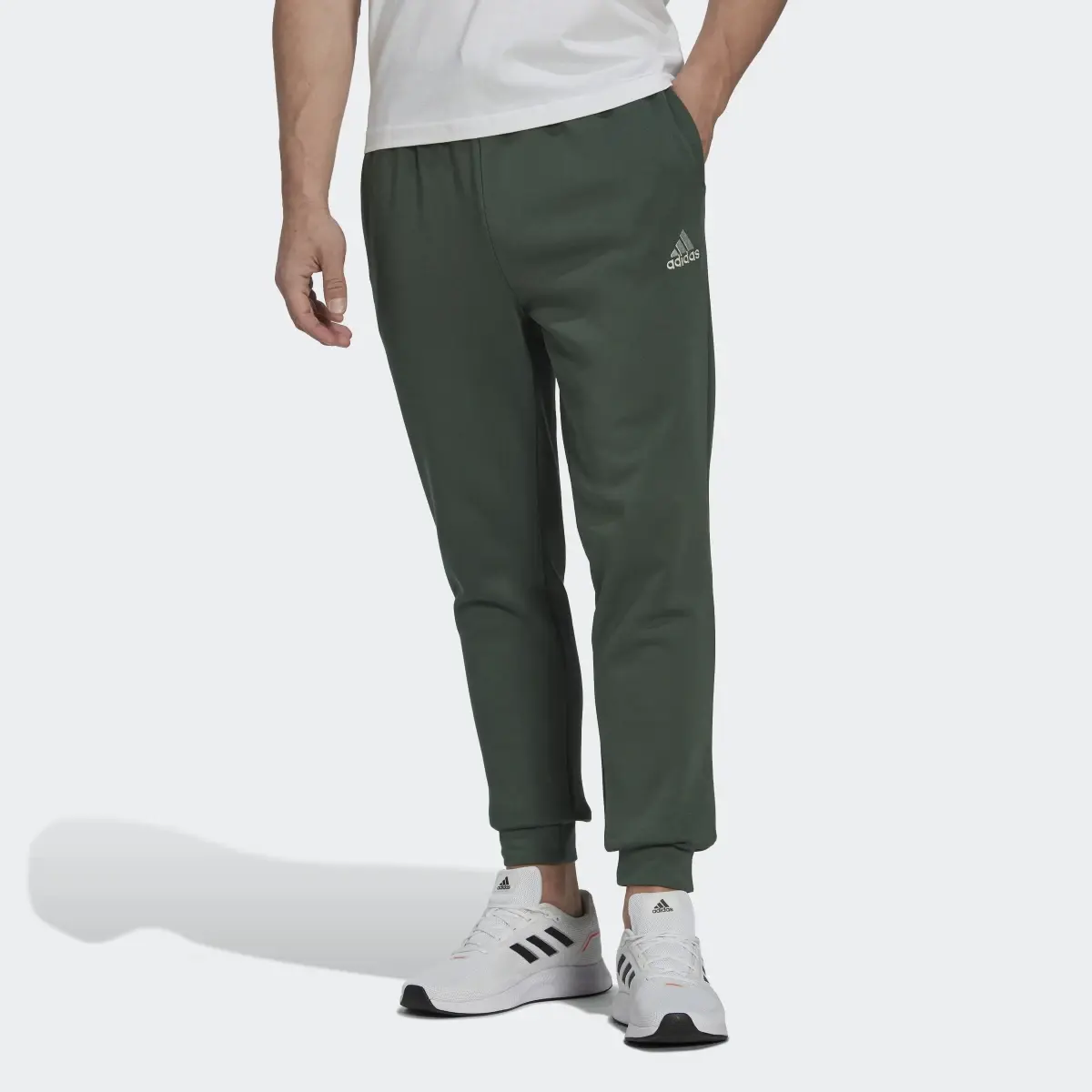 Adidas Essentials Fleece Regular Tapered Pants. 1