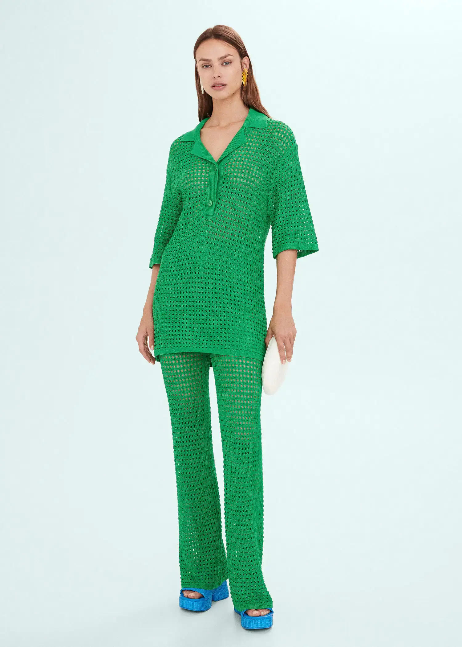 Mango Openwork knit pants. a woman in a green outfit standing in front of a white wall. 