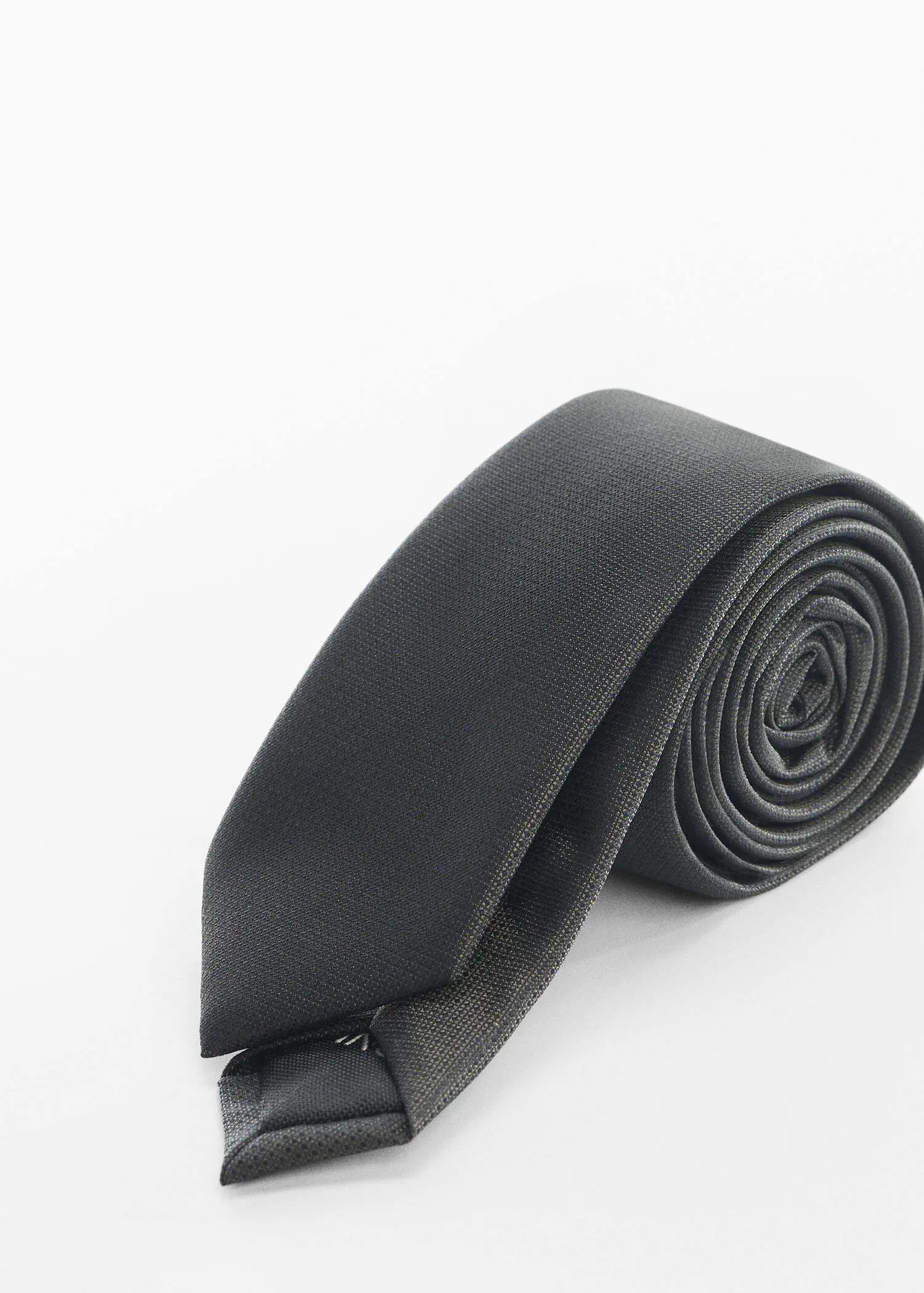Mango Narrow structured tie. a close up of a tie on a white background 
