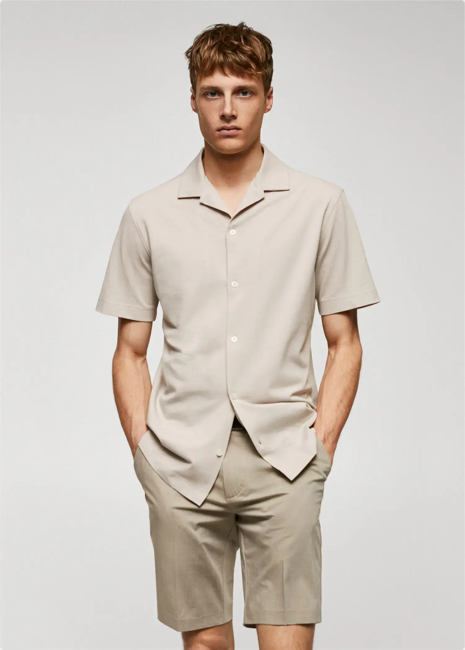 Mango Bowling-collar pique shirt. a man in a beige shirt and beige pants. 