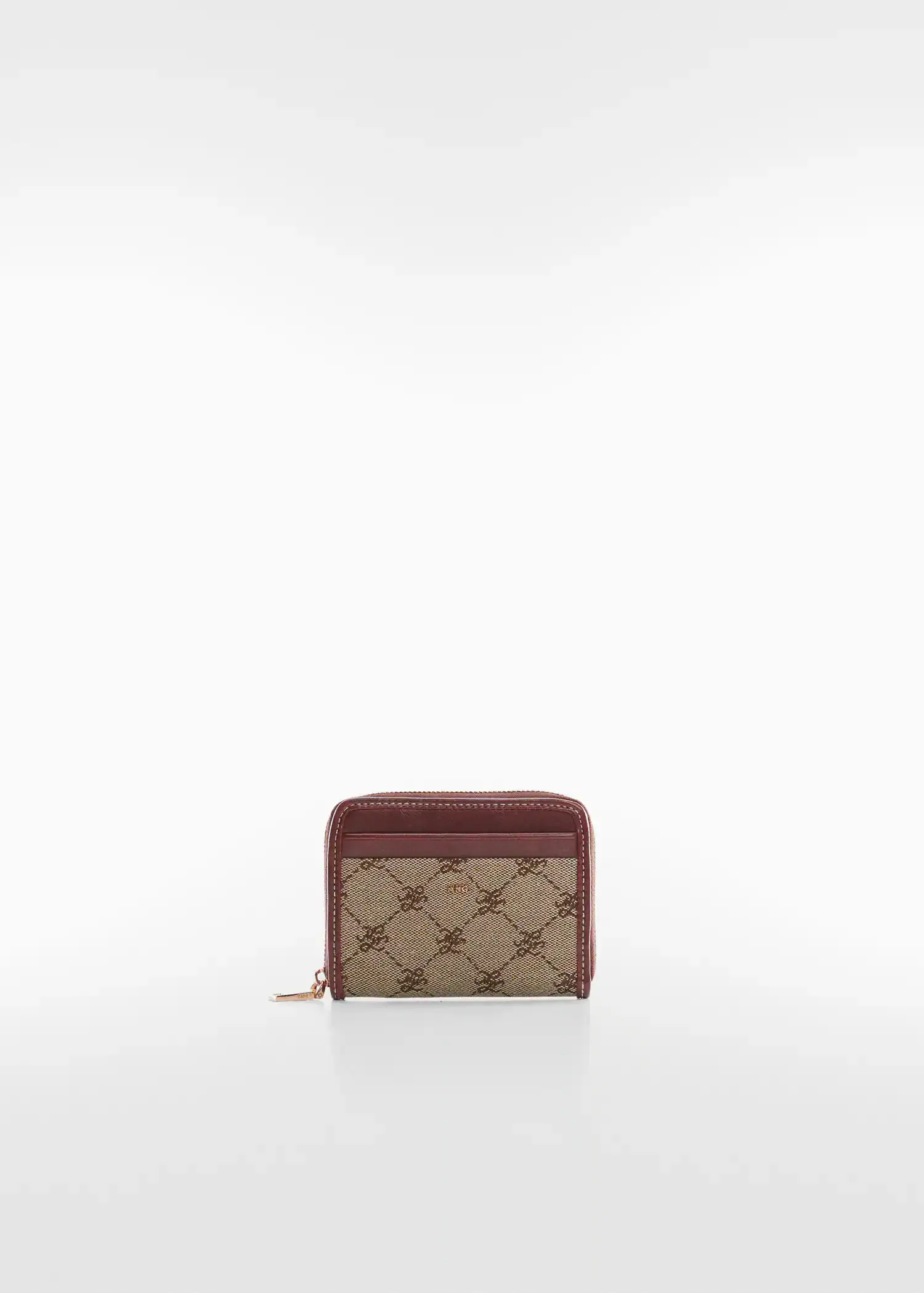 Mango Jacquard wallet. a brown and red wallet on top of a white table. 