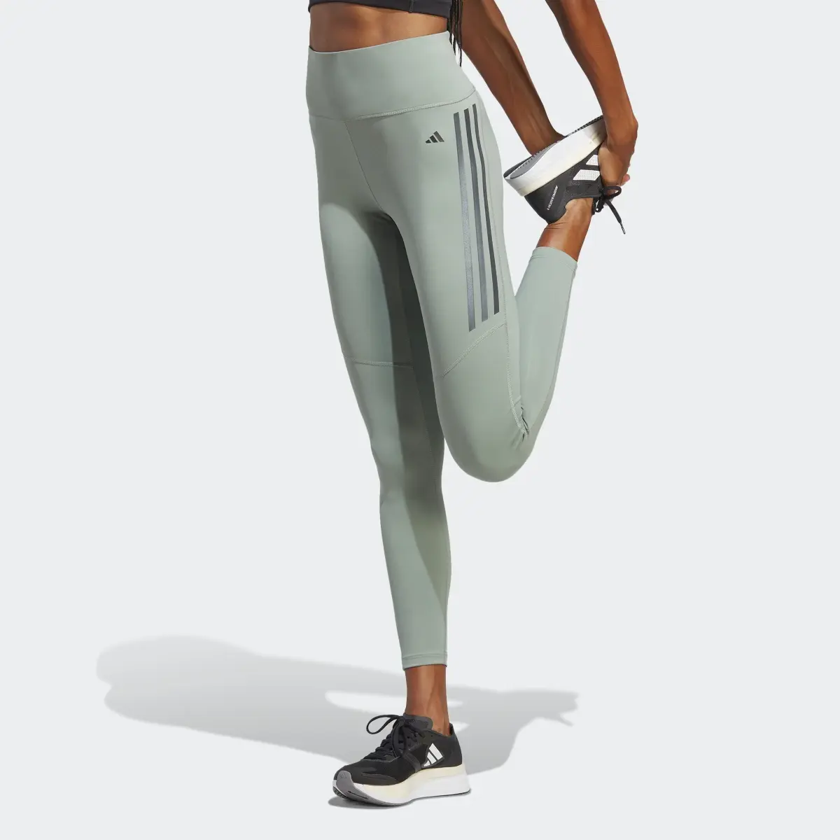 Adidas DailyRun 3-Streifen 7/8-Leggings. 1