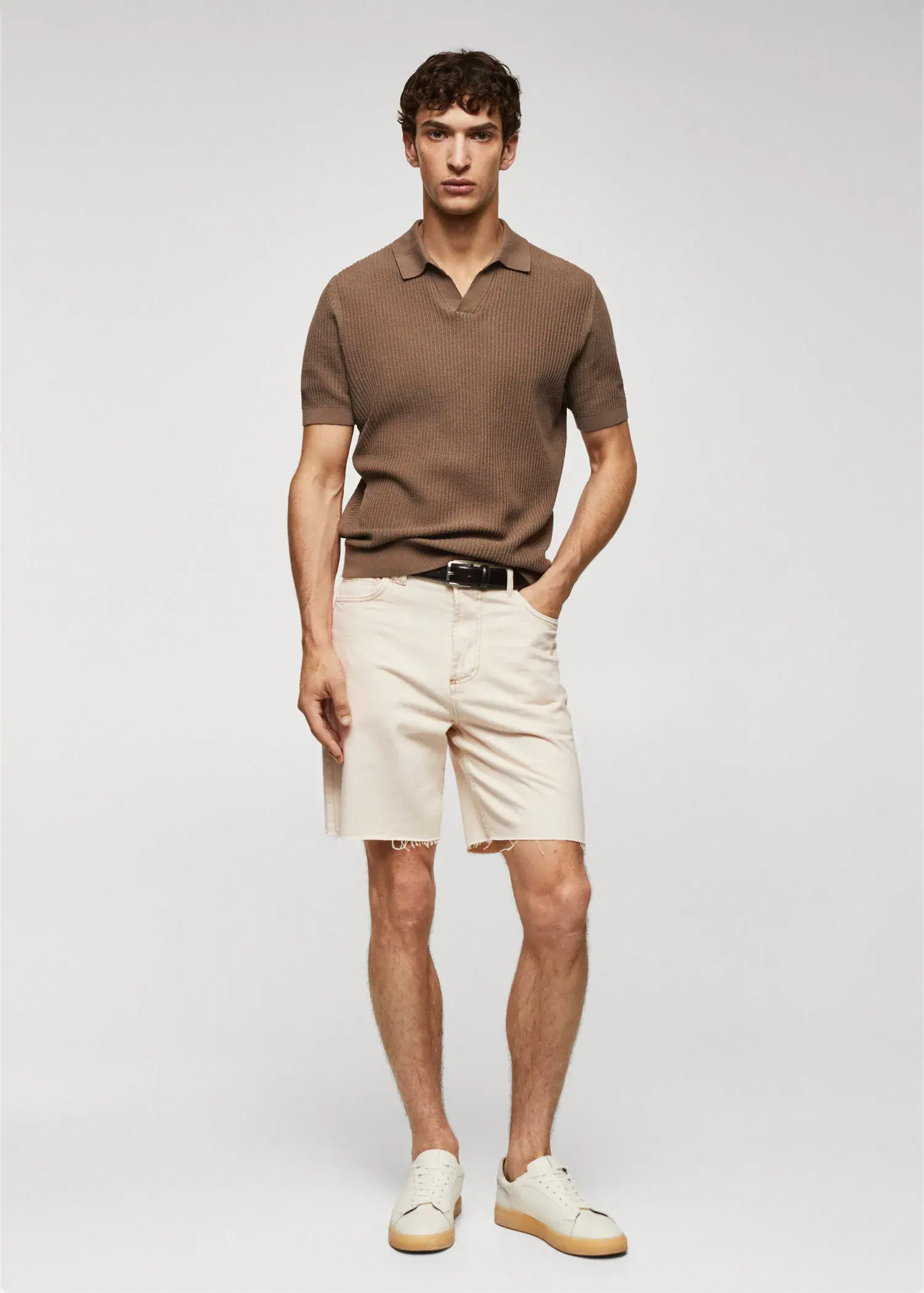 Mango Regular-fit denim bermuda shorts. a man in a brown polo shirt and white shorts. 