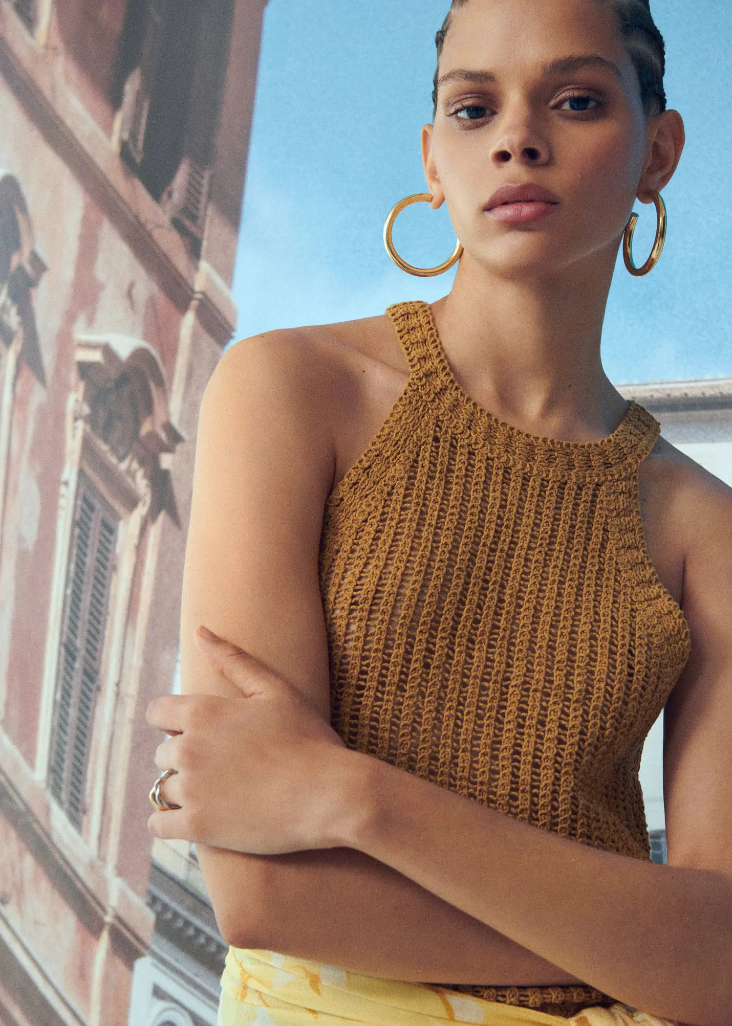 Mango Halter-neck knitted top. a close up of a person wearing a dress 