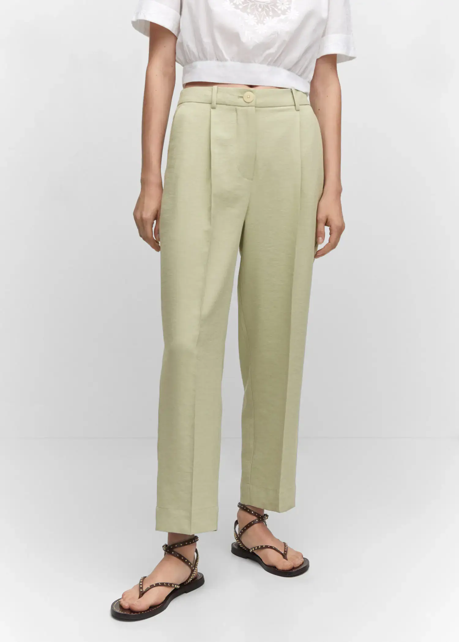 Mango Pleat straight trousers. a person wearing a pair of light green pants. 