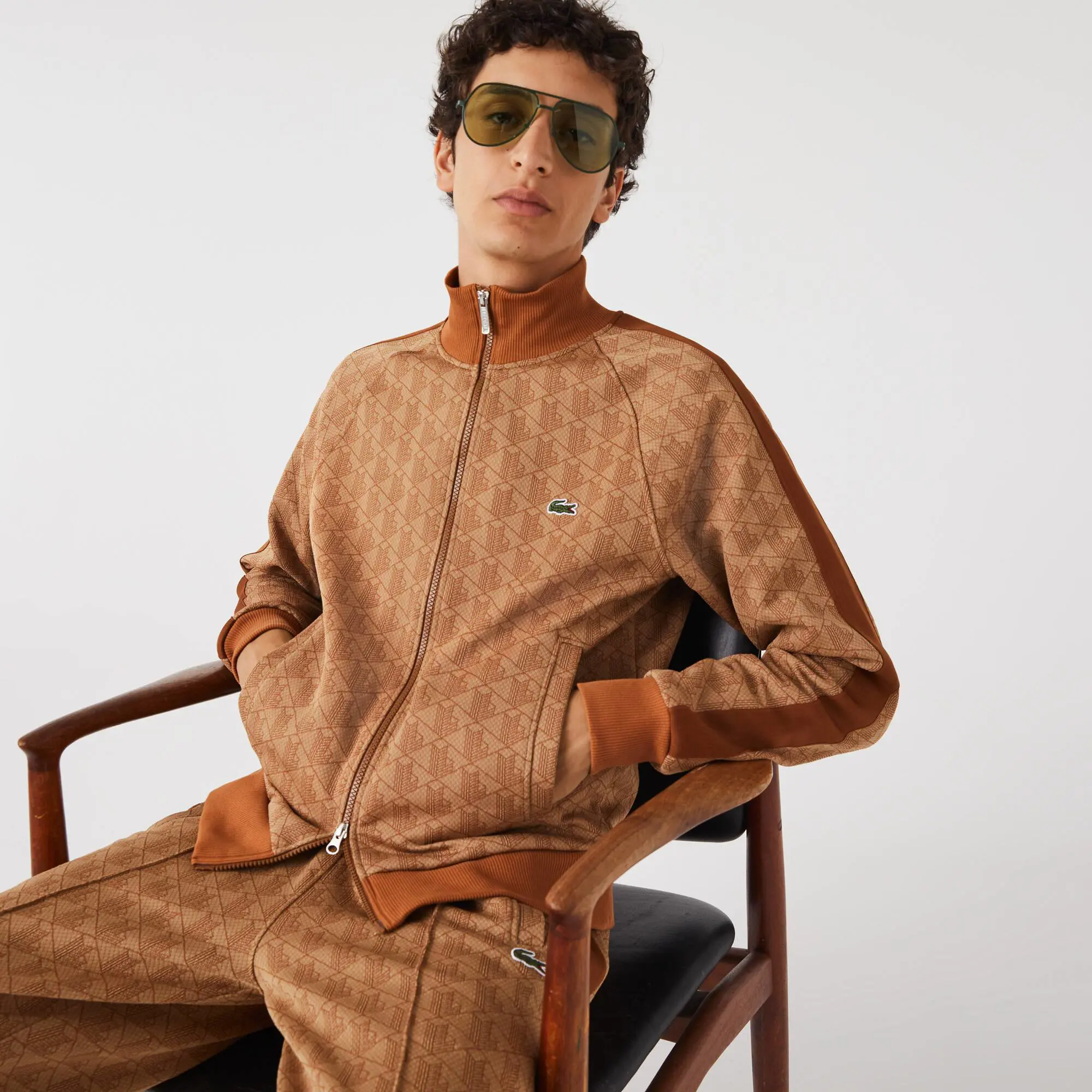 Lacoste Men's Regular Fit Monogram Zip-Up Sweatshirt. 1 Lacoste Men's Regular Fit Monogram Zip-Up Sweatshirt. 1