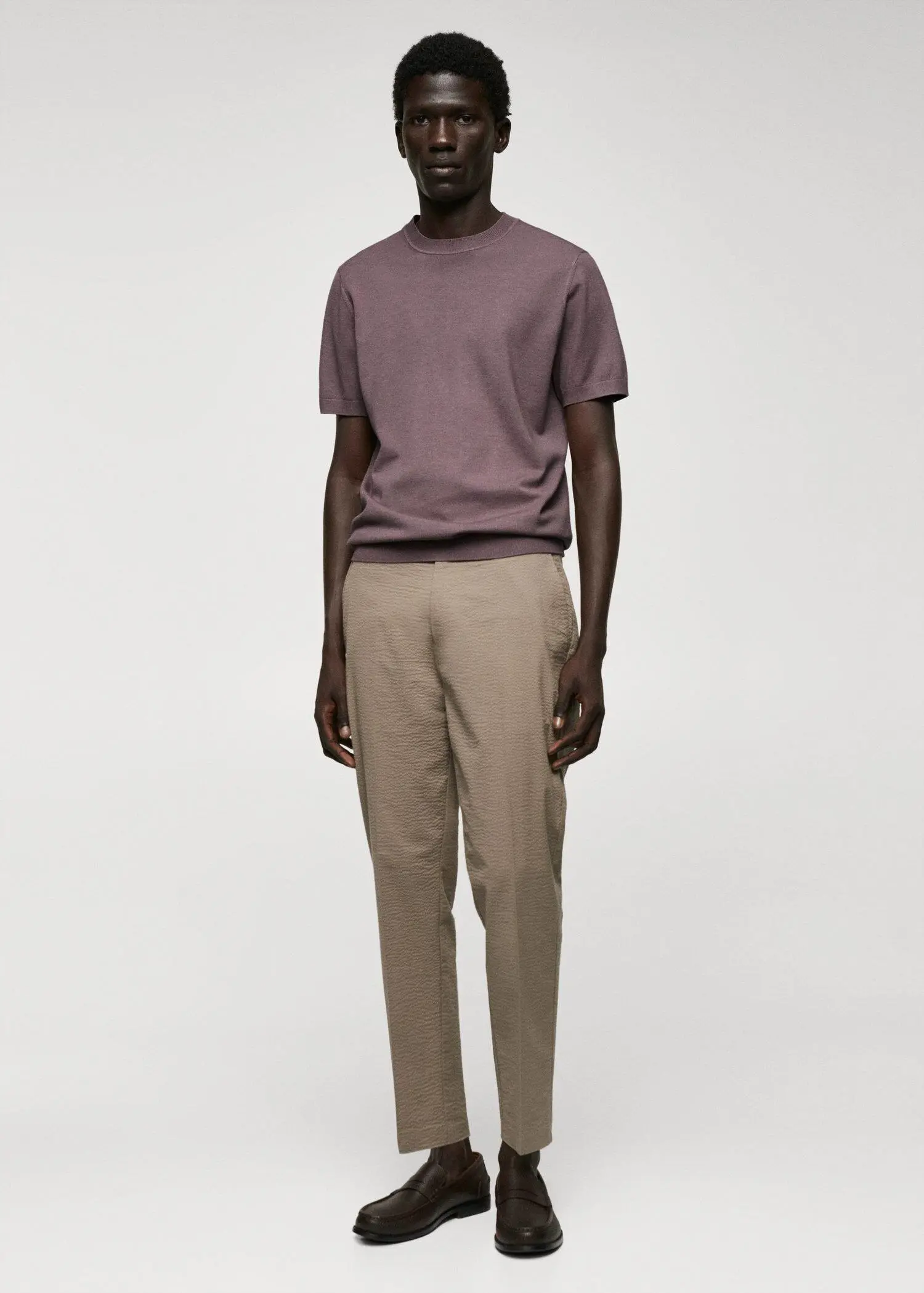 Mango Fine-knit T-shirt. a man in a purple shirt and beige pants. 