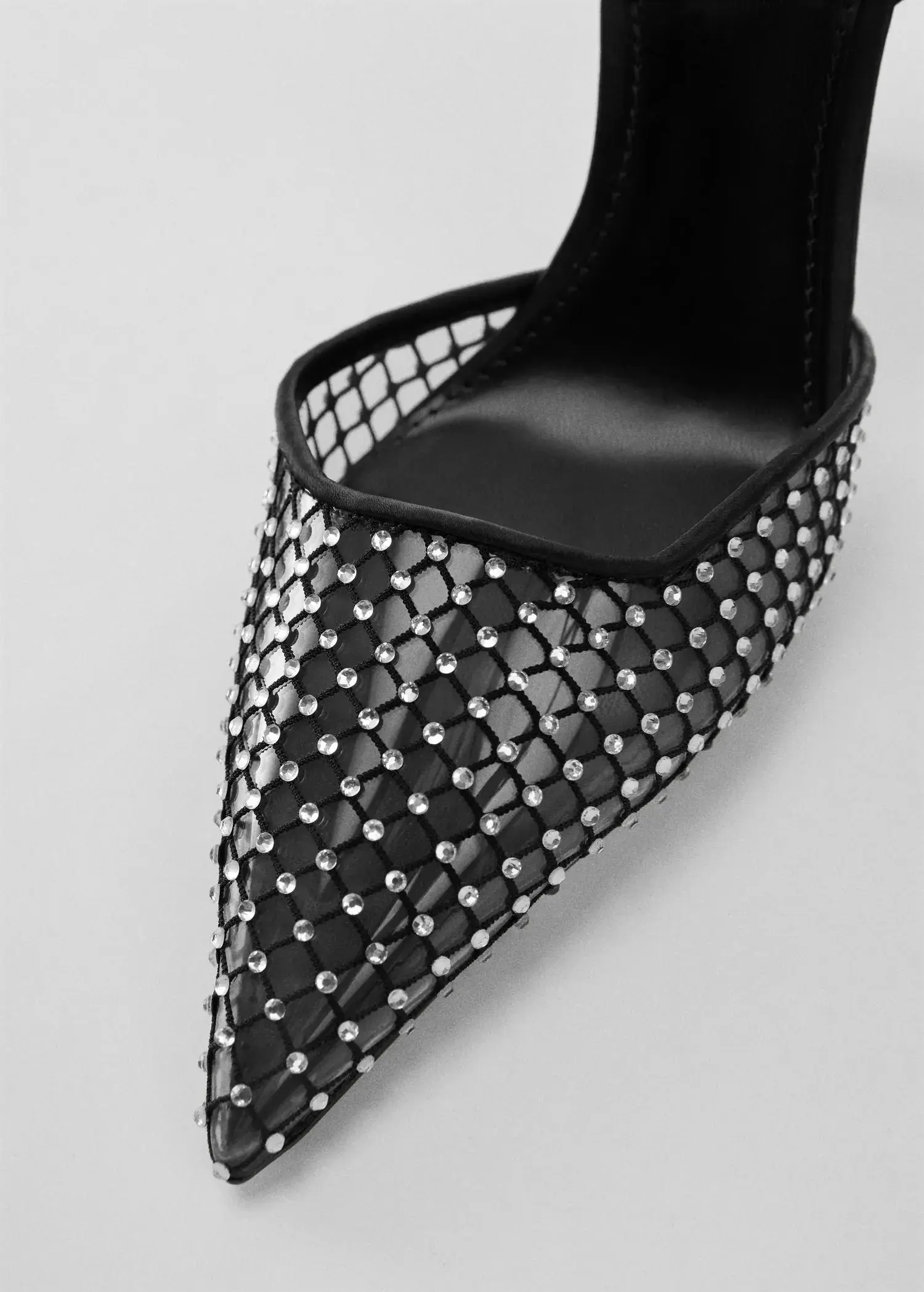 Mango Rhinestone mesh shoes. a close-up of a pair of black shoes. 