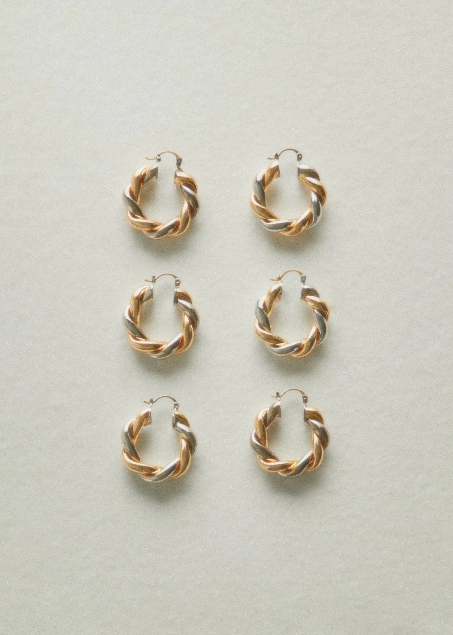 Mango Intertwined hoop earrings. a set of six pairs of gold and silver hoop earrings. 