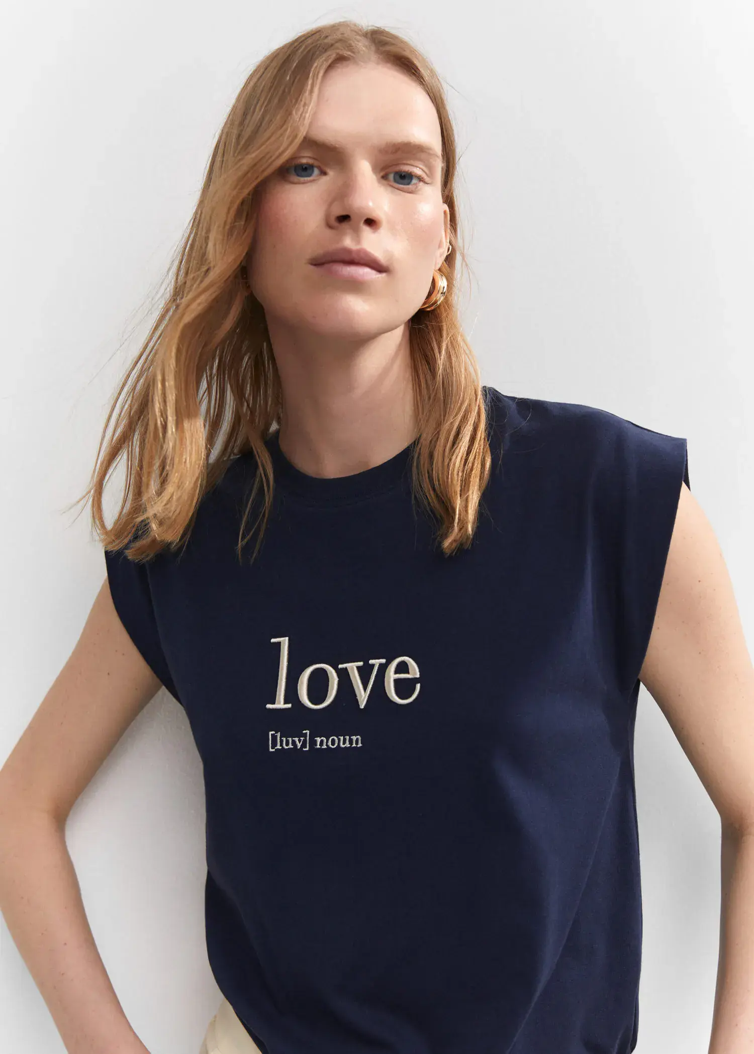 Mango Message cotton T-shirt. a woman wearing a blue shirt with the word love written on it. 