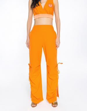 Model Detailed Trotters With Side Seam Slits Shrinkable Back Waistline Shirred Orange Trousers