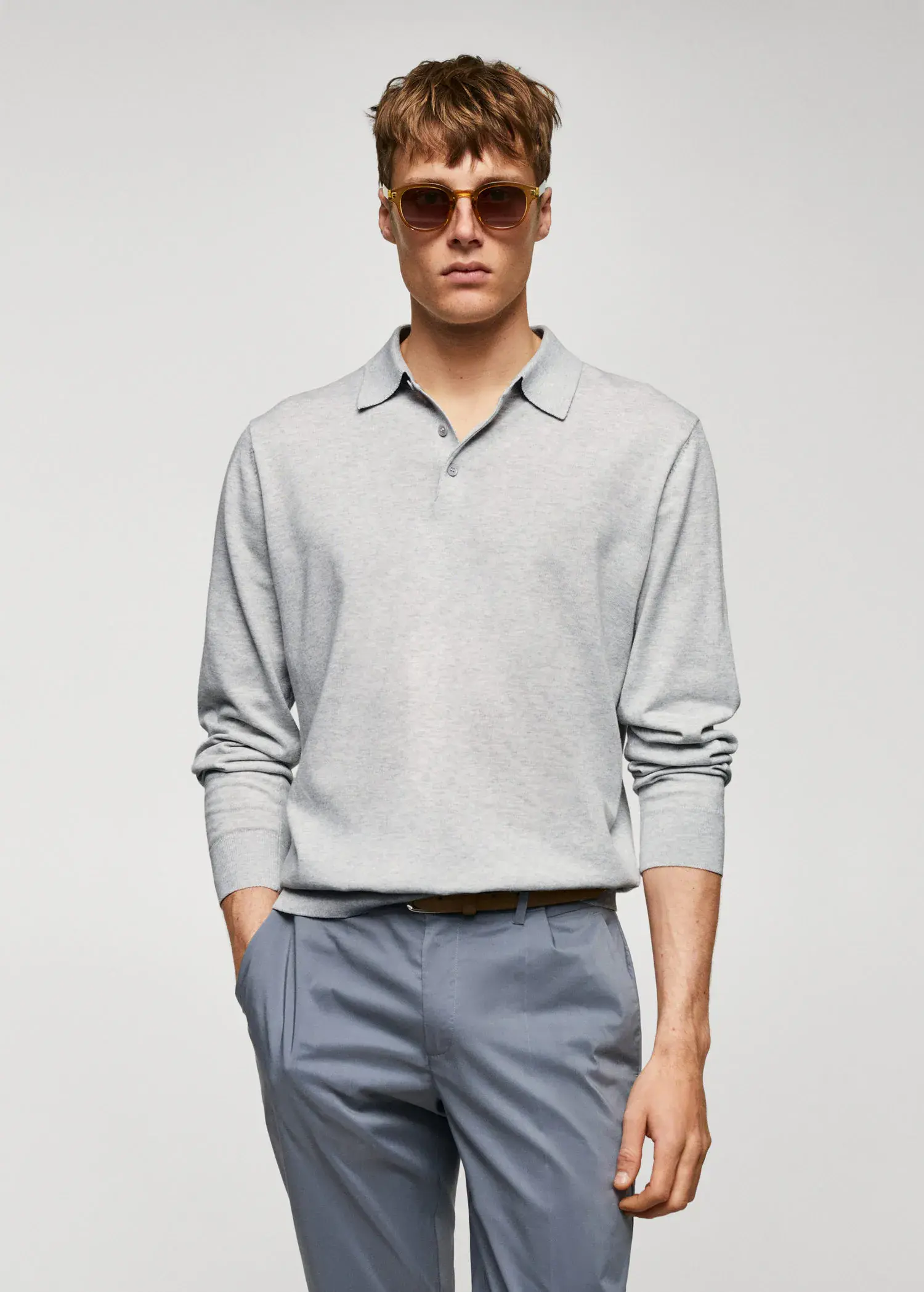 Mango Long-sleeved cotton jersey polo shirt. a man wearing a gray shirt and sunglasses. 