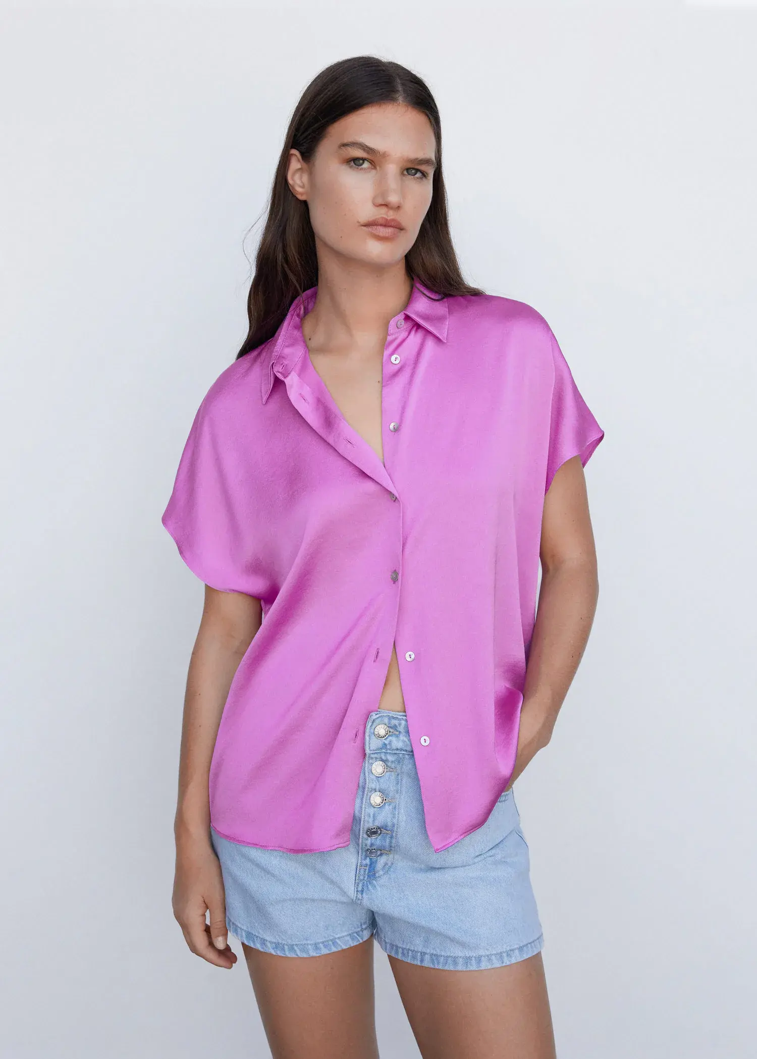 Mango Short-sleeve button-down shirt. a woman wearing a purple shirt and jeans. 