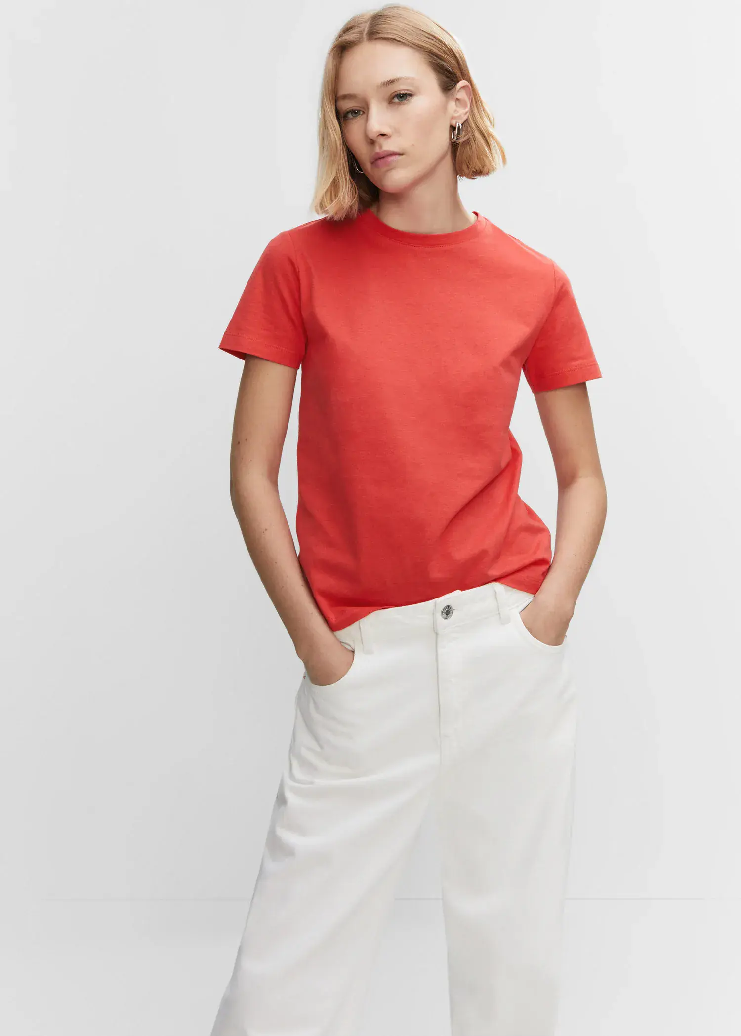 Mango 100% cotton T-shirt. a woman wearing a red shirt and white skirt. 