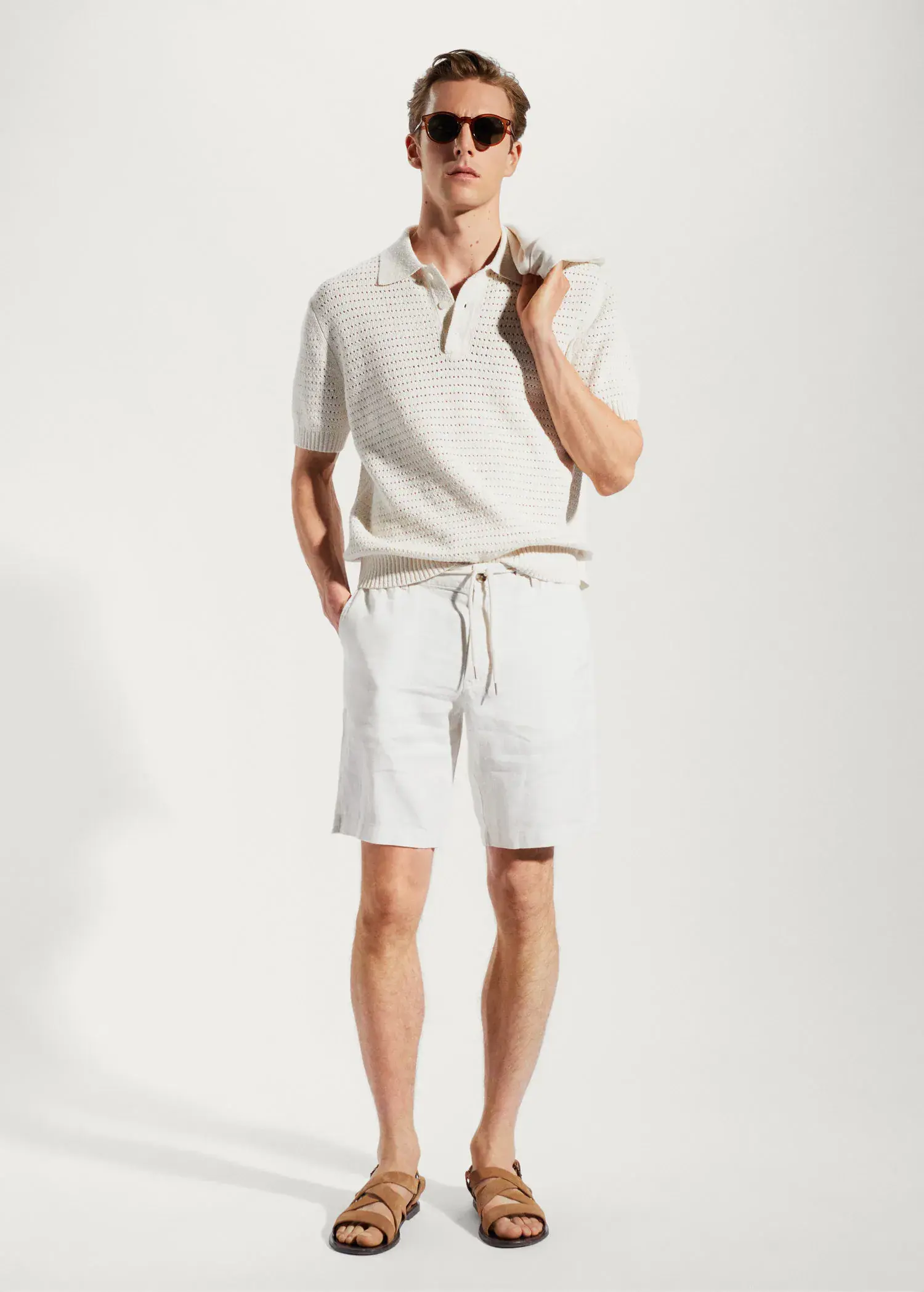 Mango 100% linen bermuda shorts with drawstring. a man in white shorts and a white polo shirt. 