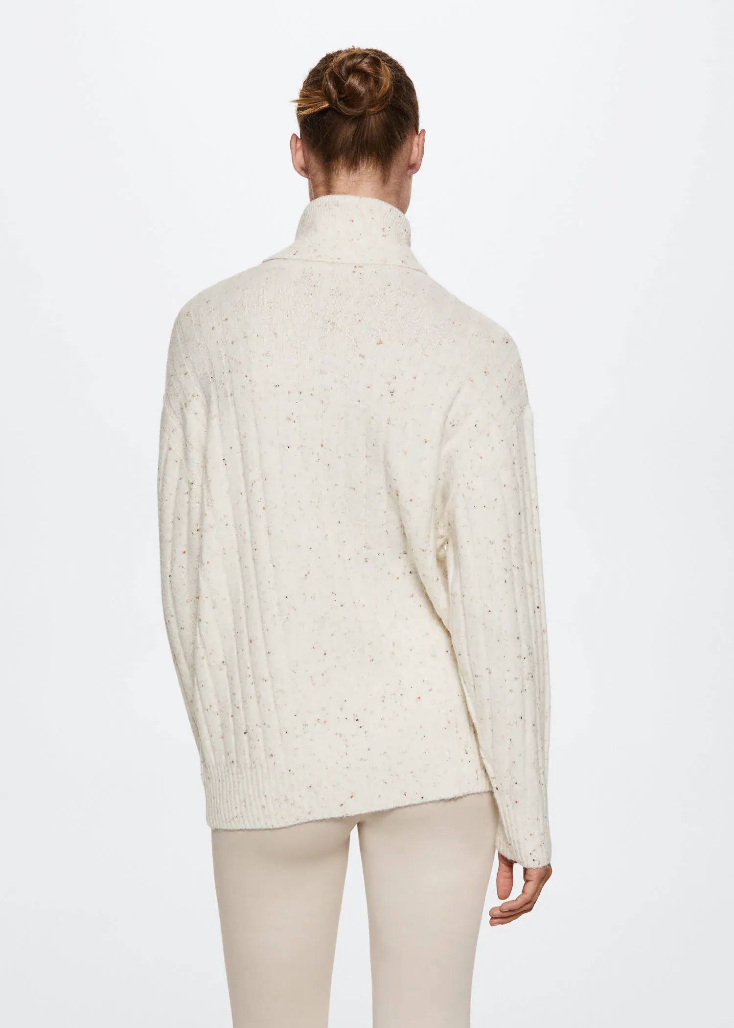 Mango Fleece turtleneck sweater. a person wearing a white sweater and white pants. 