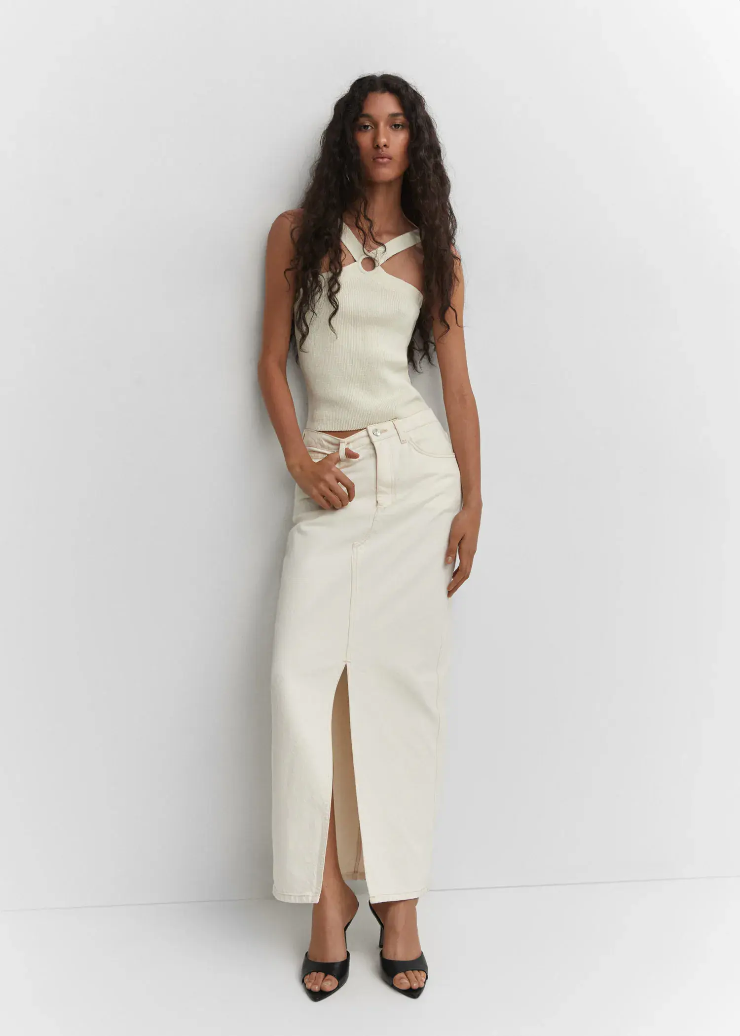 Mango Heel non-structured sandals. a woman leaning up against a wall wearing a white dress. 