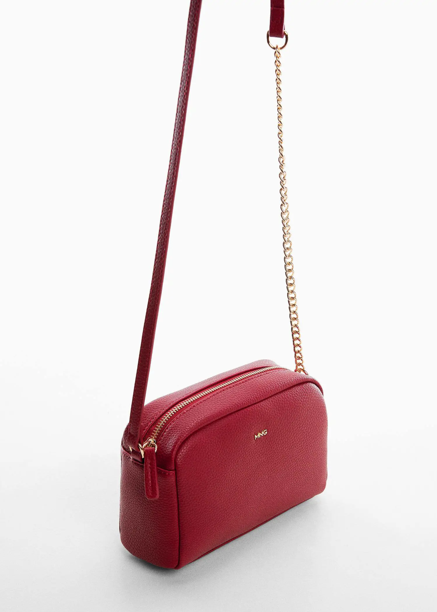 Mango Crossbody bag with chain. a close up of a red purse on a white surface 