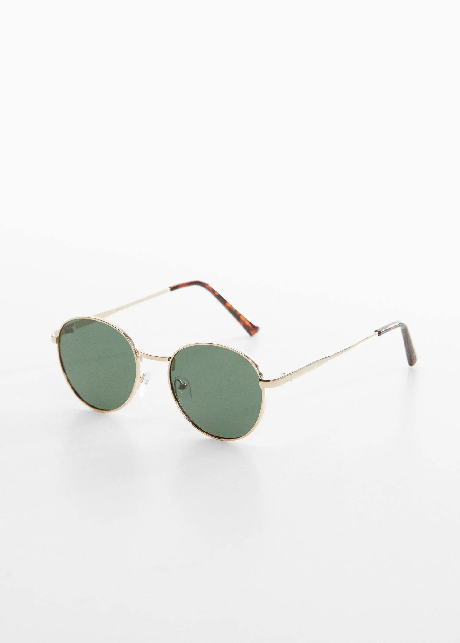 Mango Polarised sunglasses. a pair of green sunglasses sitting on top of a table. 