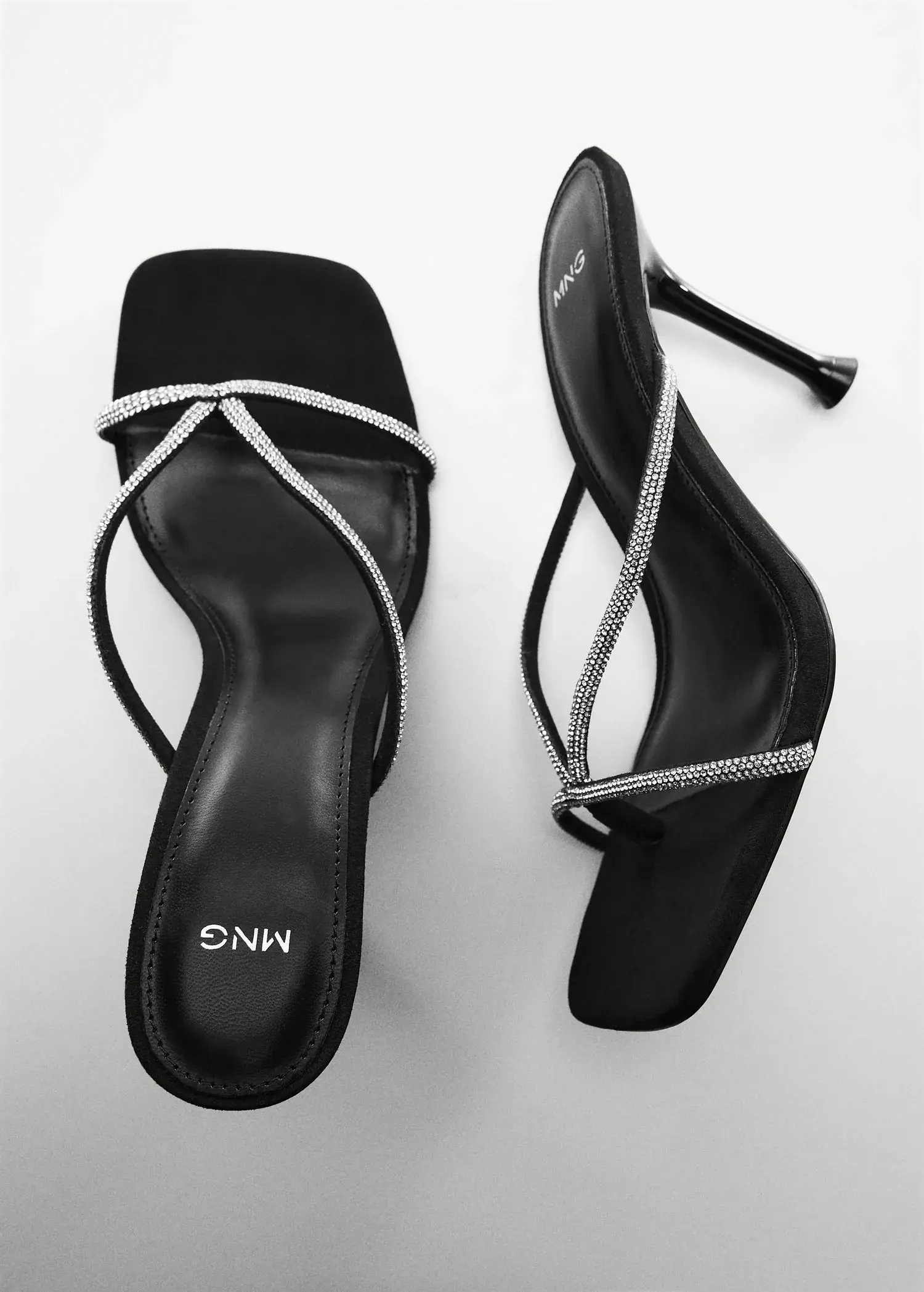 Mango Heeled sandals with rhinestone straps. a pair of black sandals with a diamond pattern on them. 
