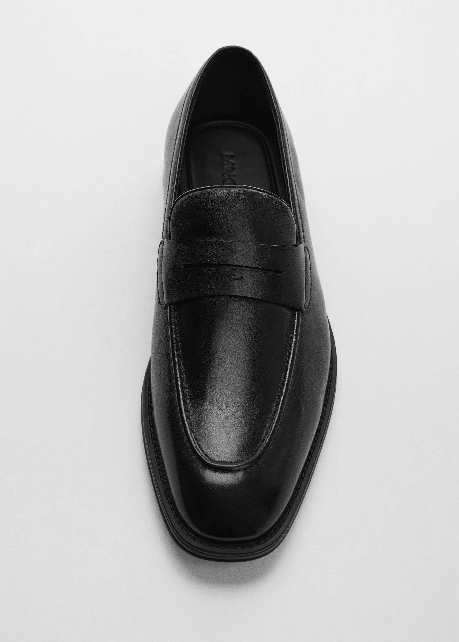 Mango Aged-leather loafers. a pair of black loafers on top of a white surface. 