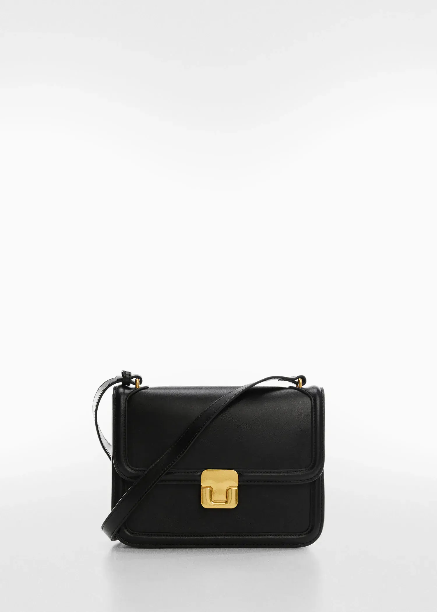 Mango Cross-body bag. a black leather bag with a gold clasp. 