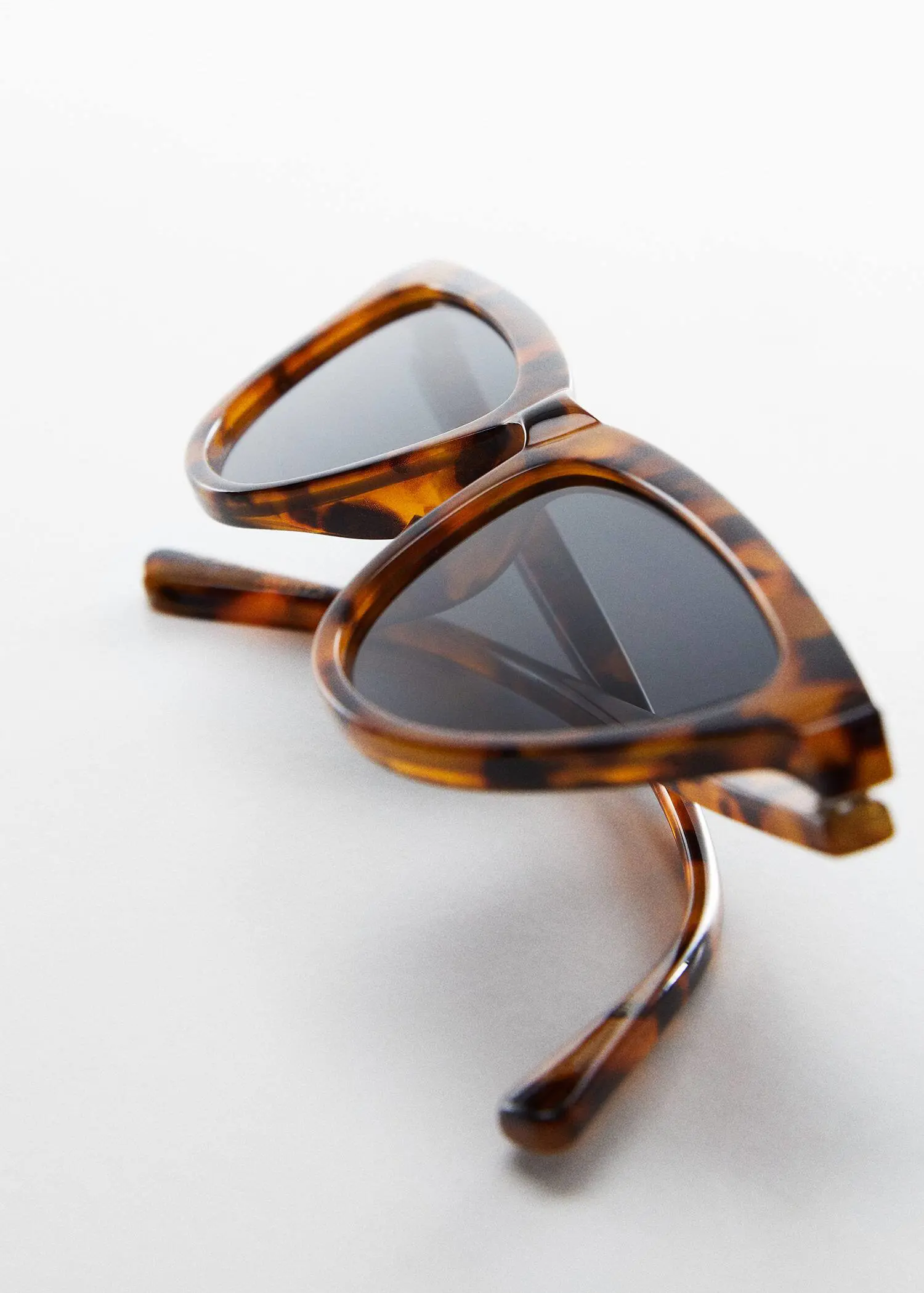 Mango Retro style sunglasses. a close up of a pair of sunglasses. 