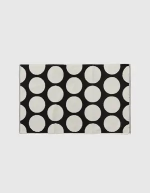 black bathroom rug with white polka dots