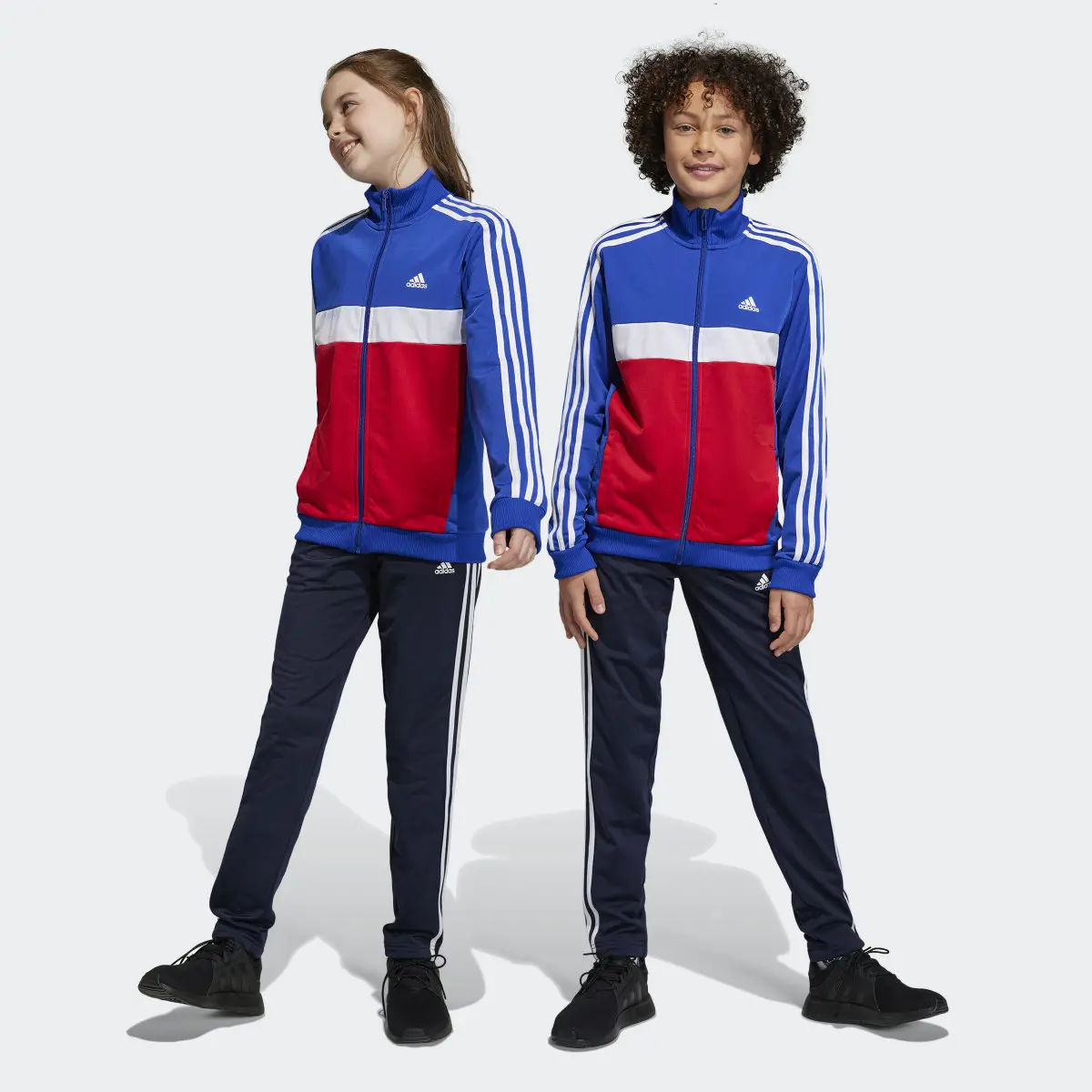 Adidas Track suit Essentials 3-Stripes Tiberio. 1