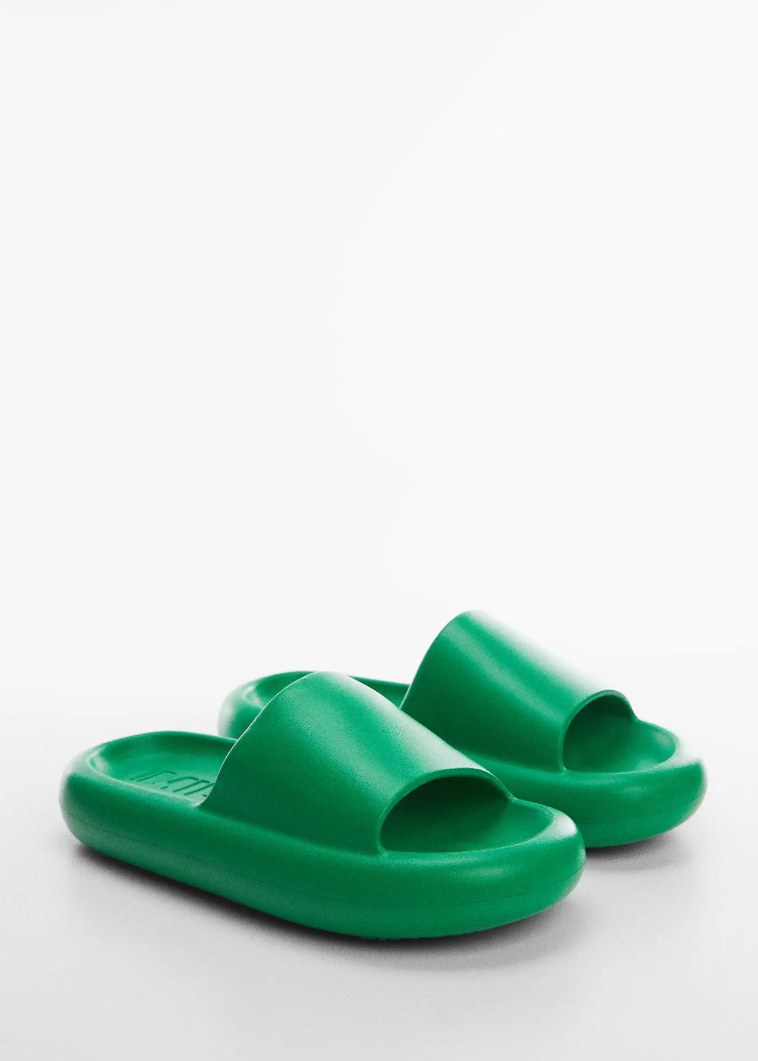 Mango Platform sandals. a pair of green sandals sitting on top of a table. 