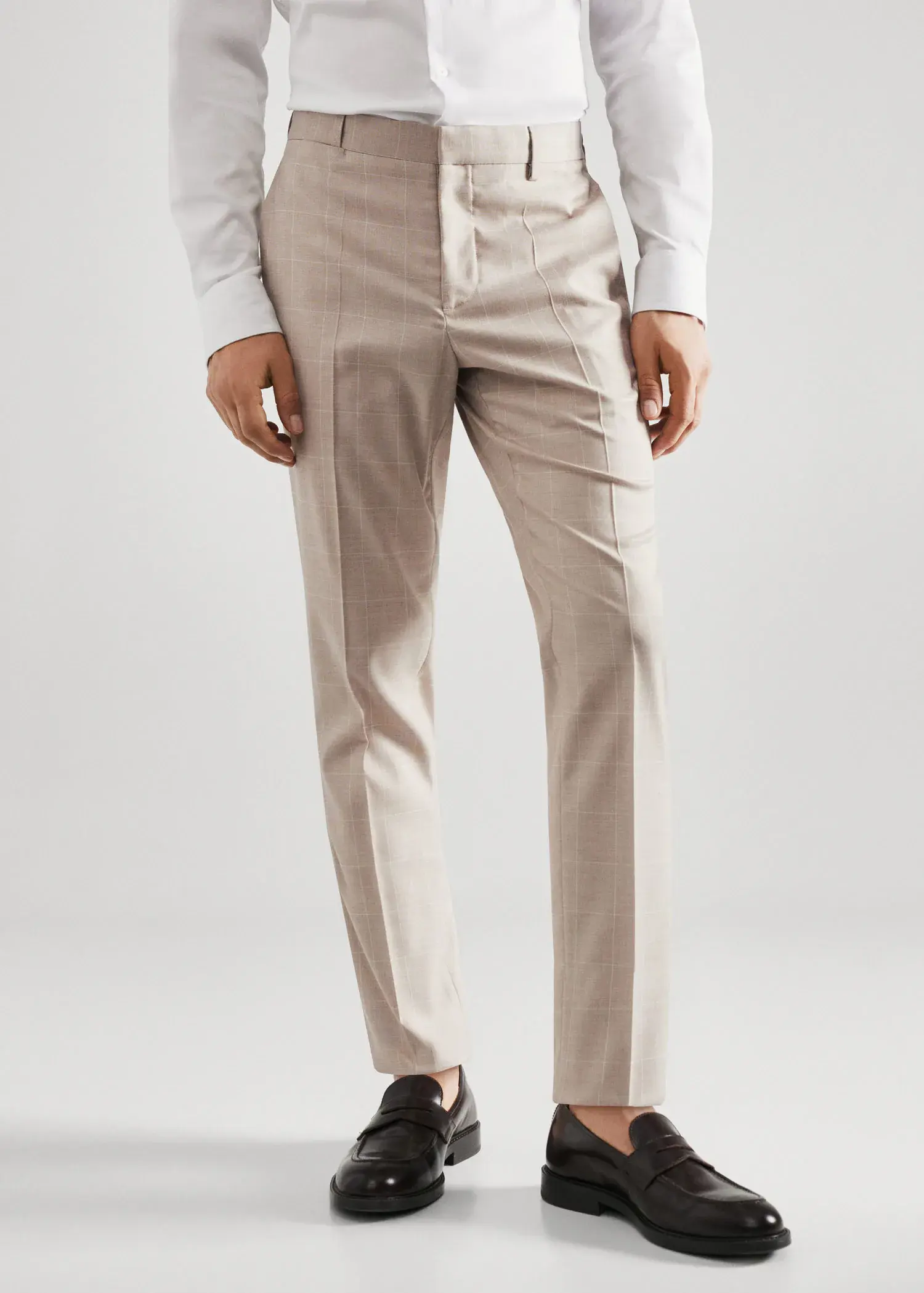 Mango Super slim-fit Tailored check pants. a man wearing a suit and tie. 