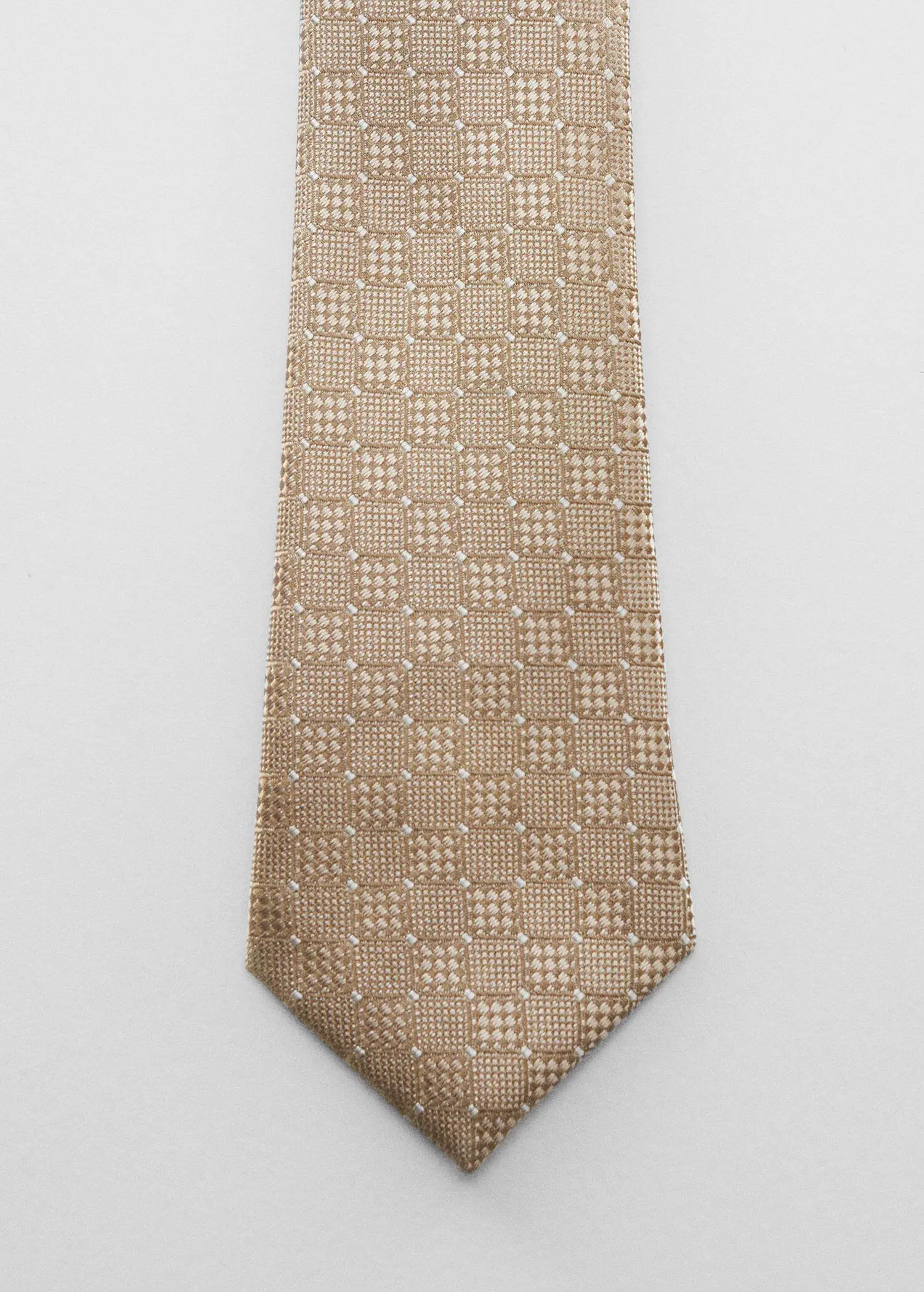 Mango Geometric-structure tie. a close up of a tie on a white background 