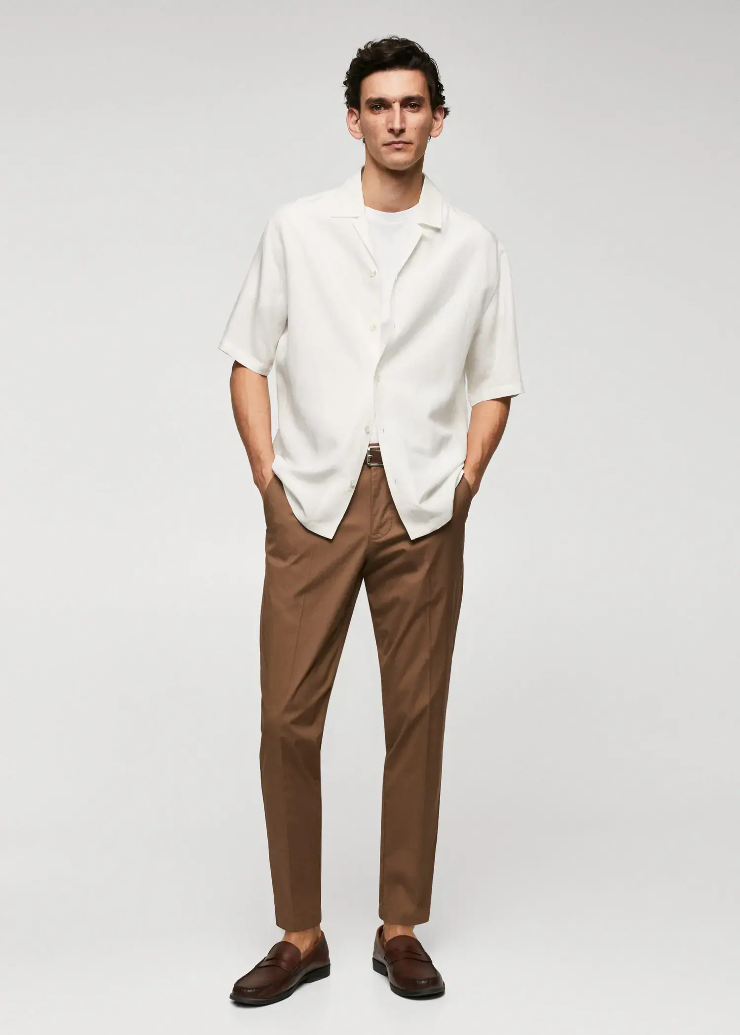 Mango Slim-fit cotton trousers. a man wearing a white shirt and brown pants. 
