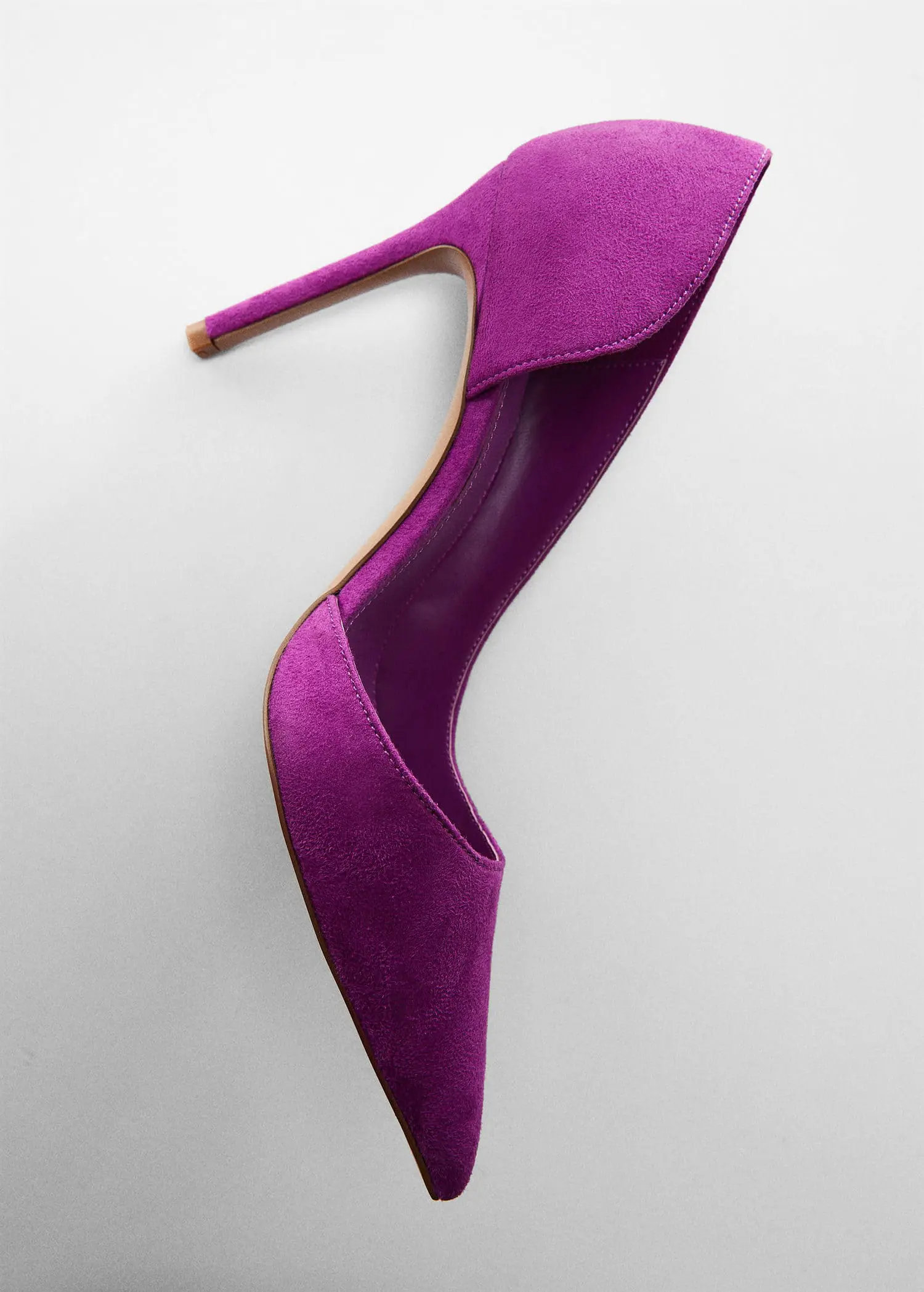 Mango Asymmetrical heeled shoes. a pair of purple high heels on a white surface. 