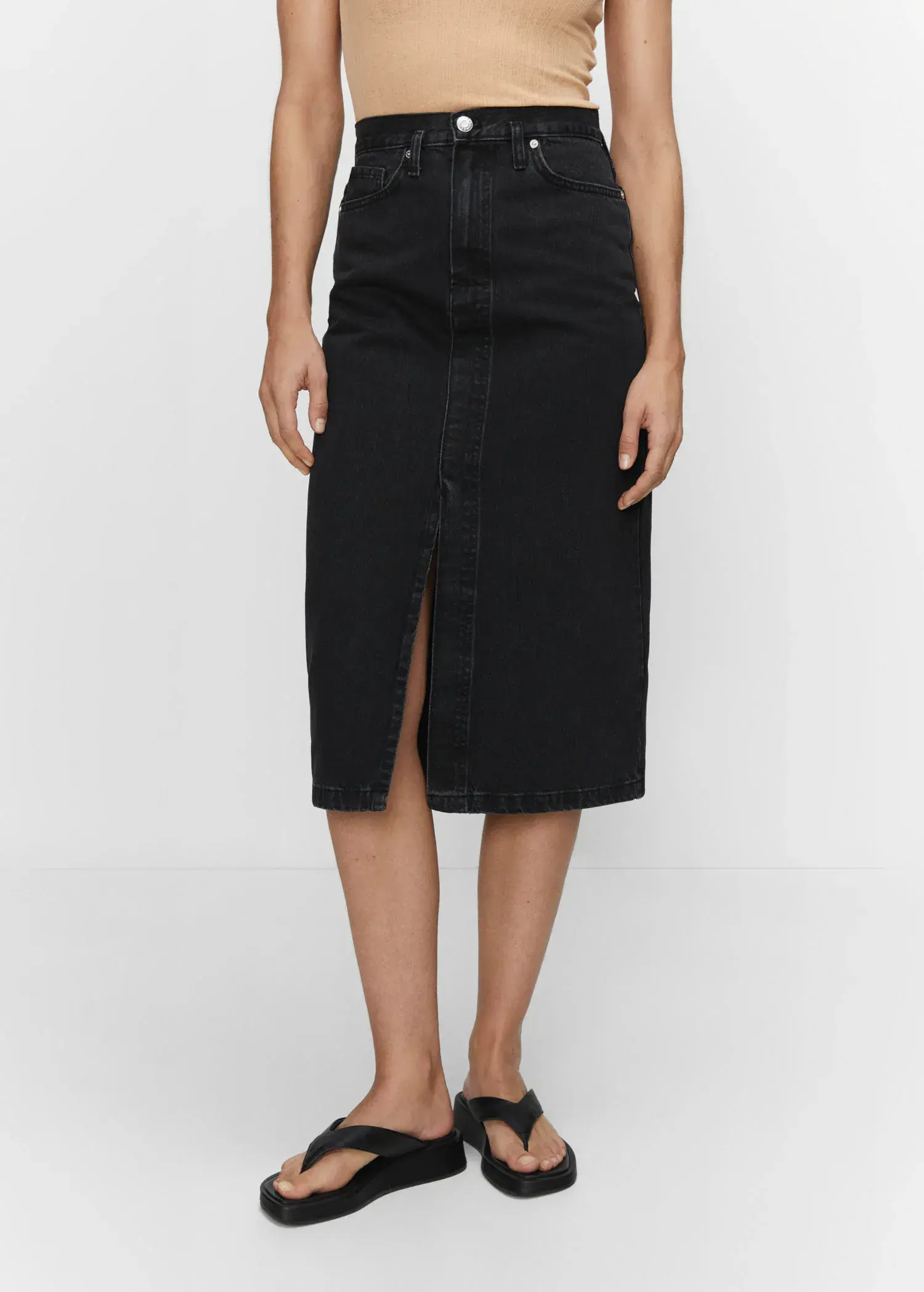 Mango Denim midi-skirt. a woman is wearing a black denim skirt. 