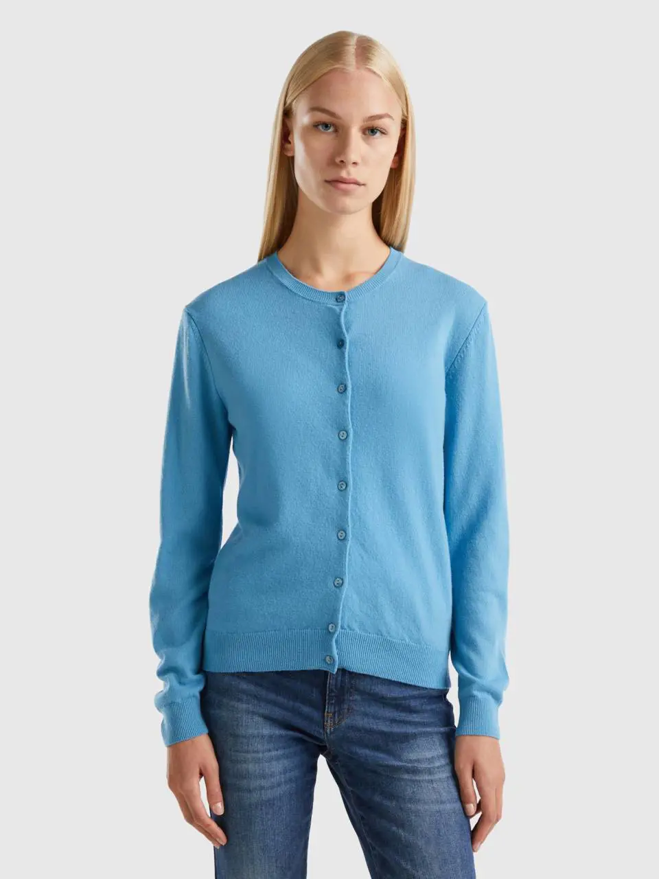 Benetton light blue crew neck cardigan in pure merino wool. 1