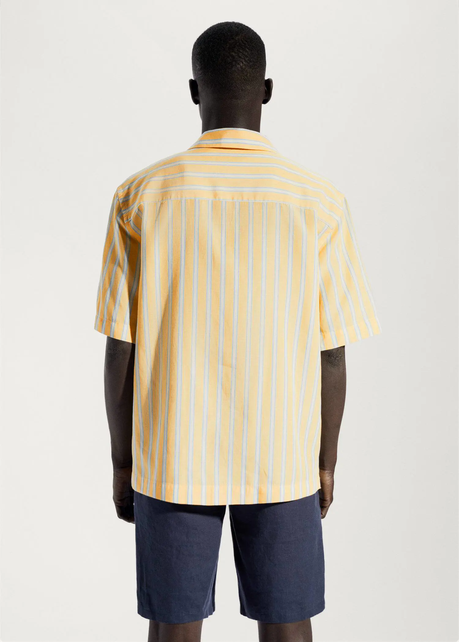 Mango Striped cotton linen shirt. a person wearing a yellow striped shirt. 