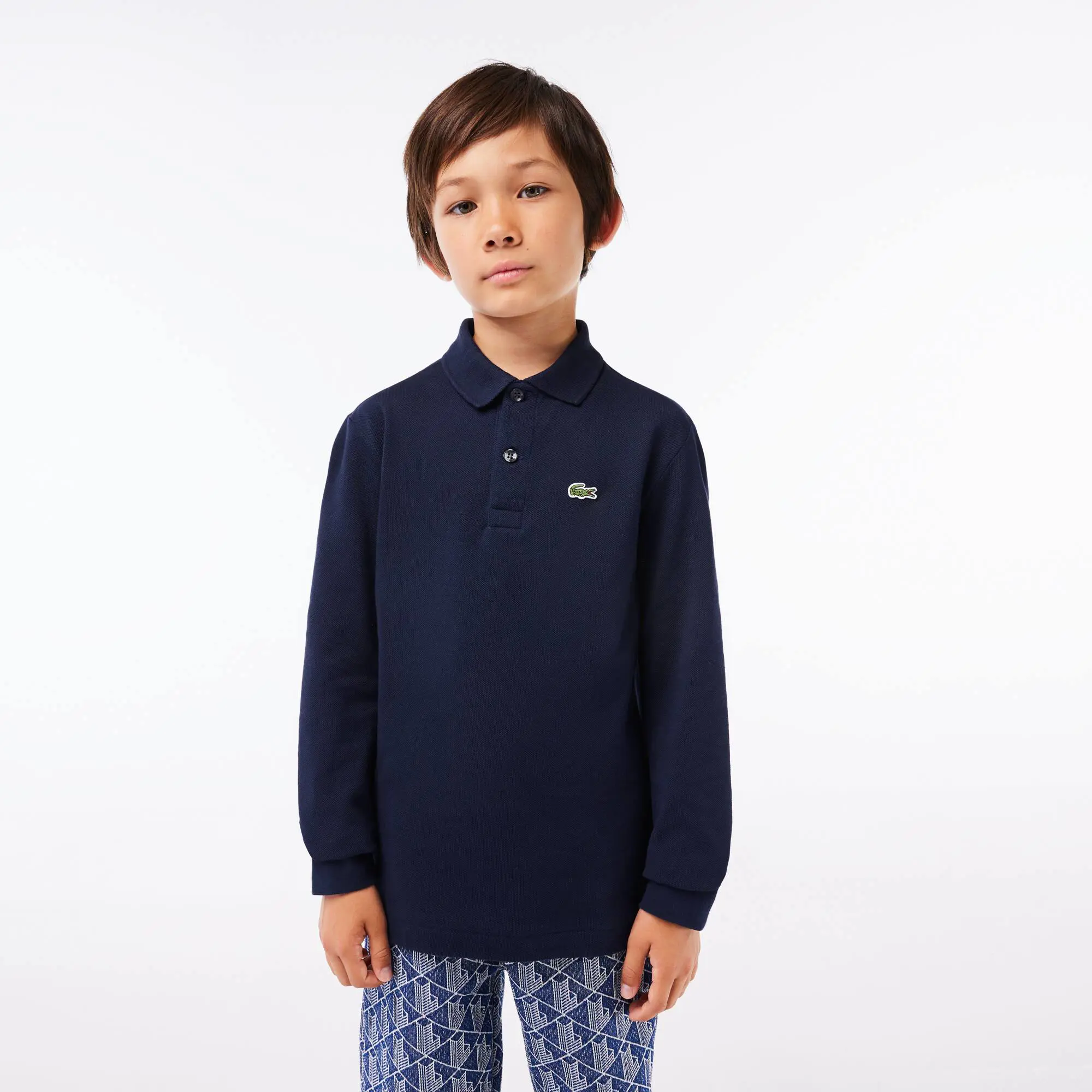 Lacoste Polo da bambino regular fit a maniche lunghe Lacoste in petit piqué tinta unita. 1