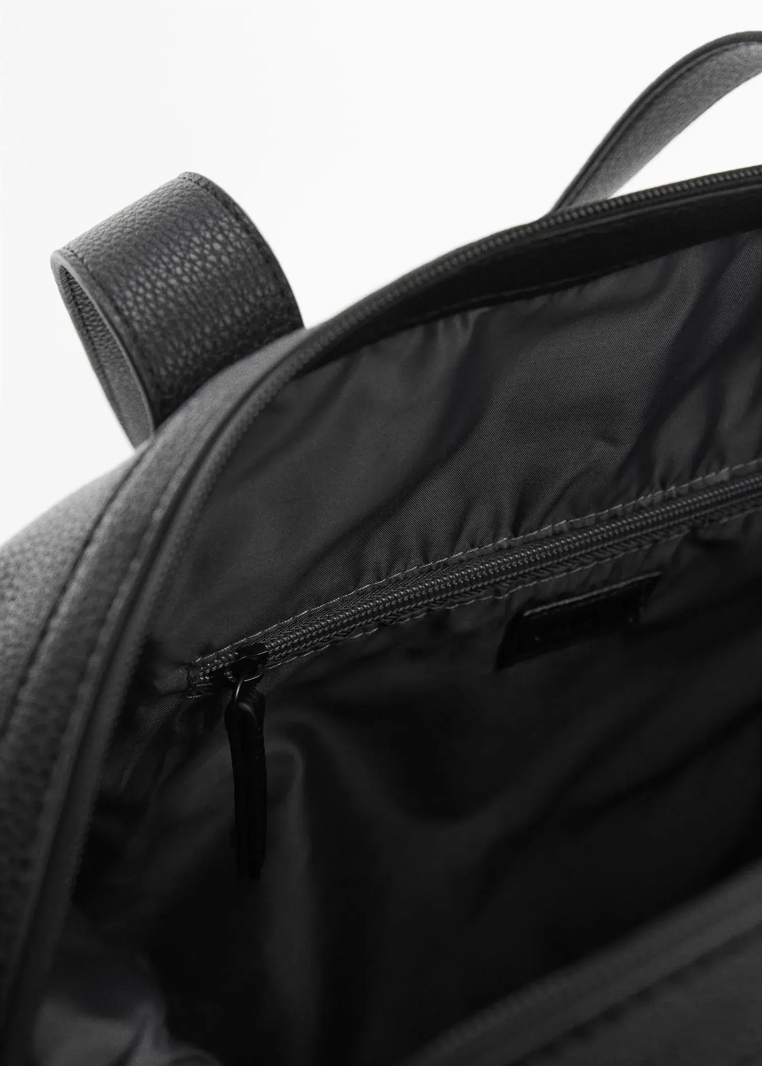 Mango Leather-effect travel bowling bag. a close-up view of the inside of a black bag. 