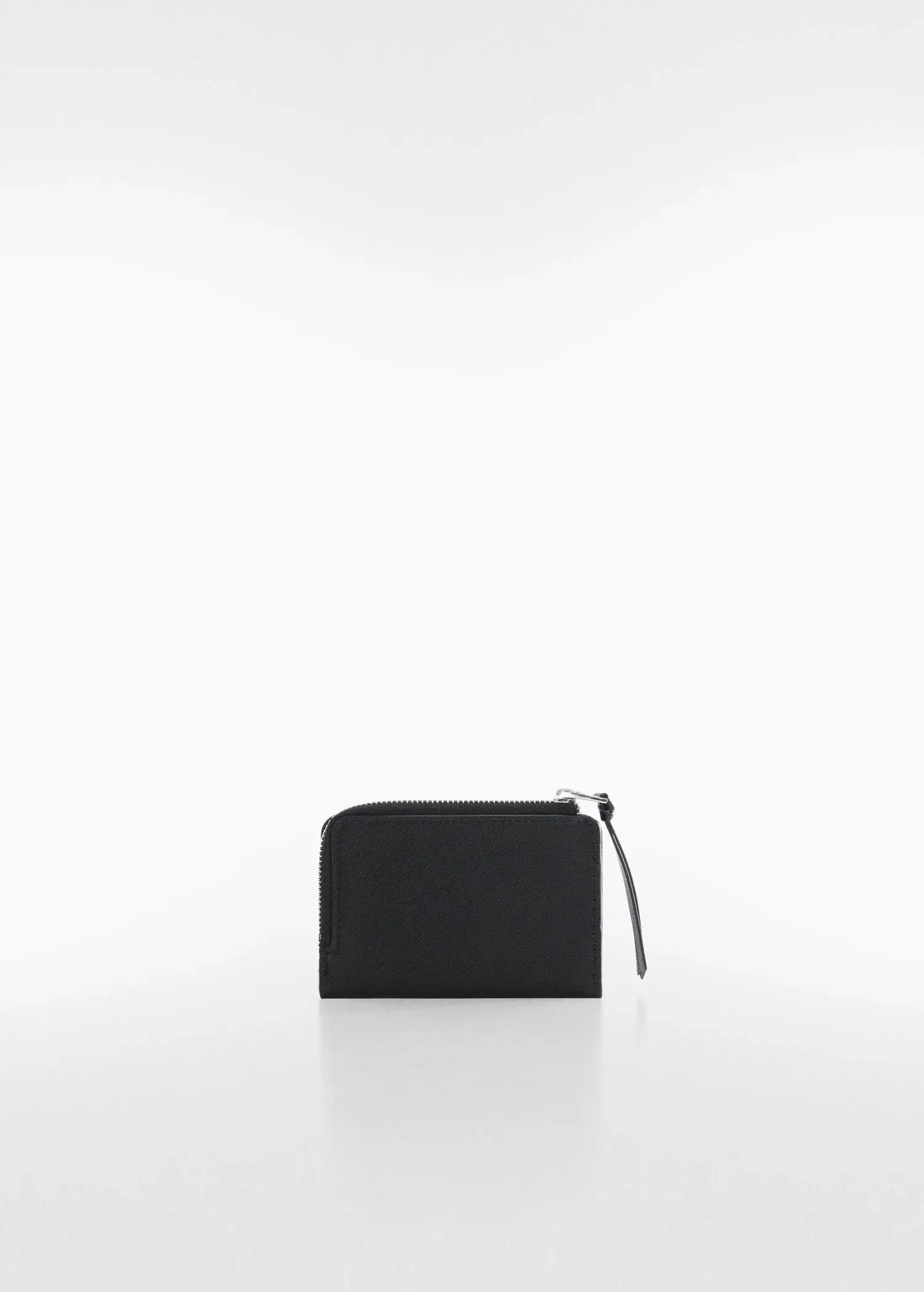 Mango Saffiano-effect wallet. a black wallet sitting on top of a white table. 