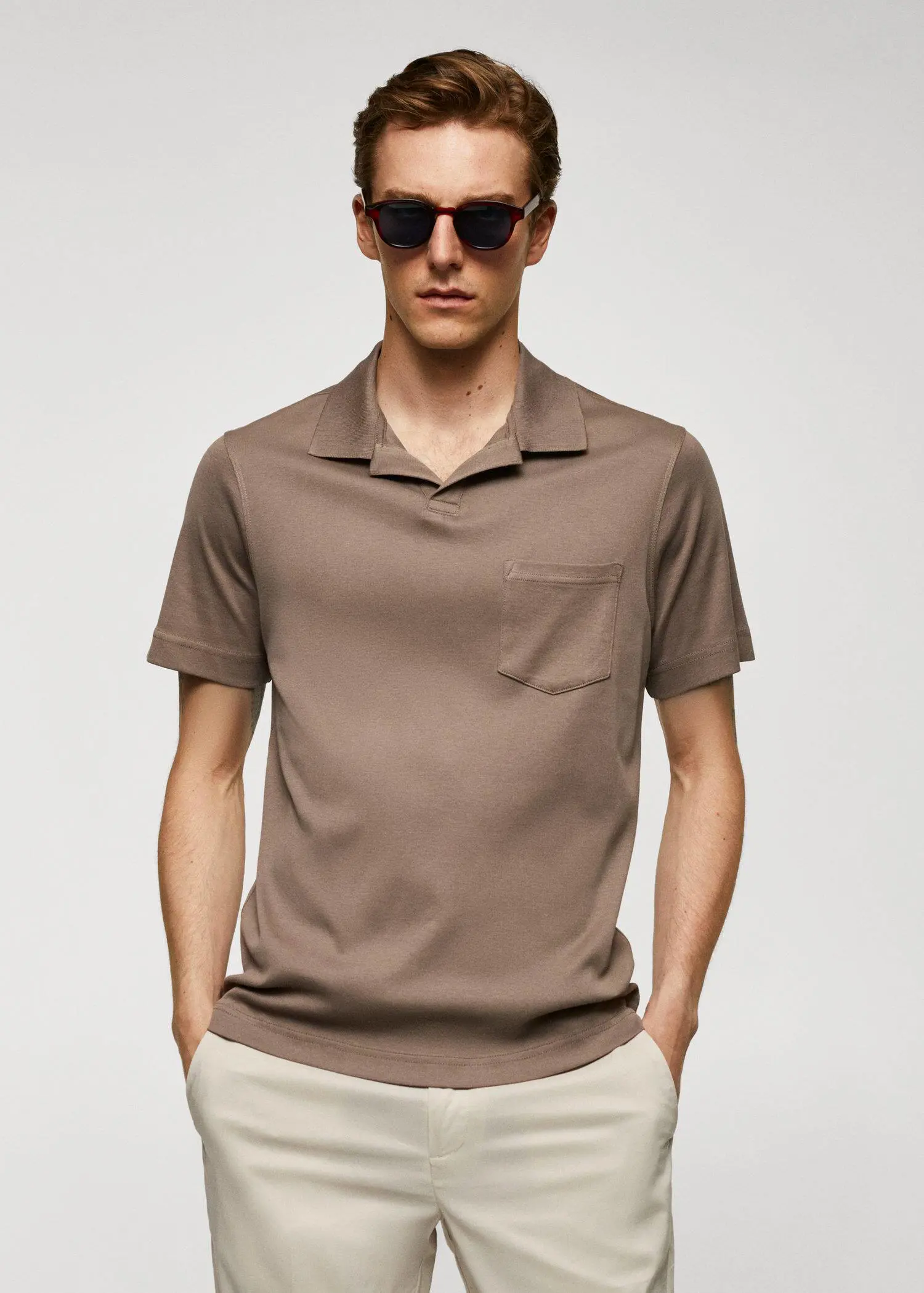 Mango 100% cotton polo shirt with pocket. a man wearing a brown shirt and sunglasses. 