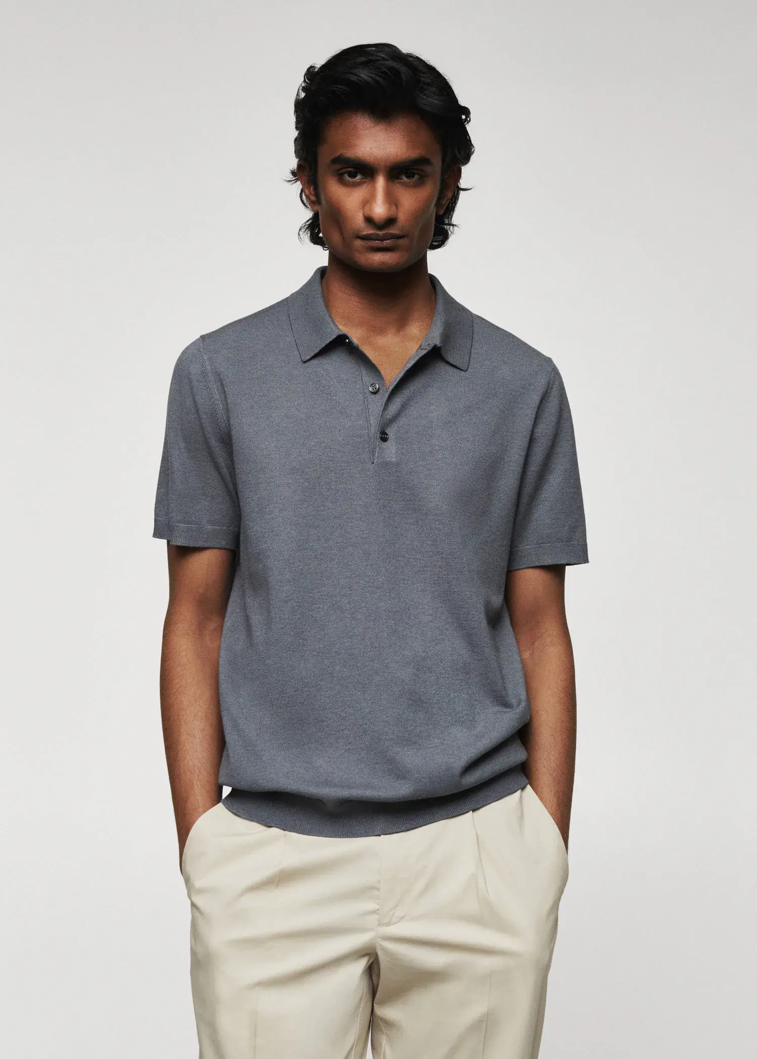 Mango Fine-knit polo shirt. a man wearing a gray polo shirt and white pants. 