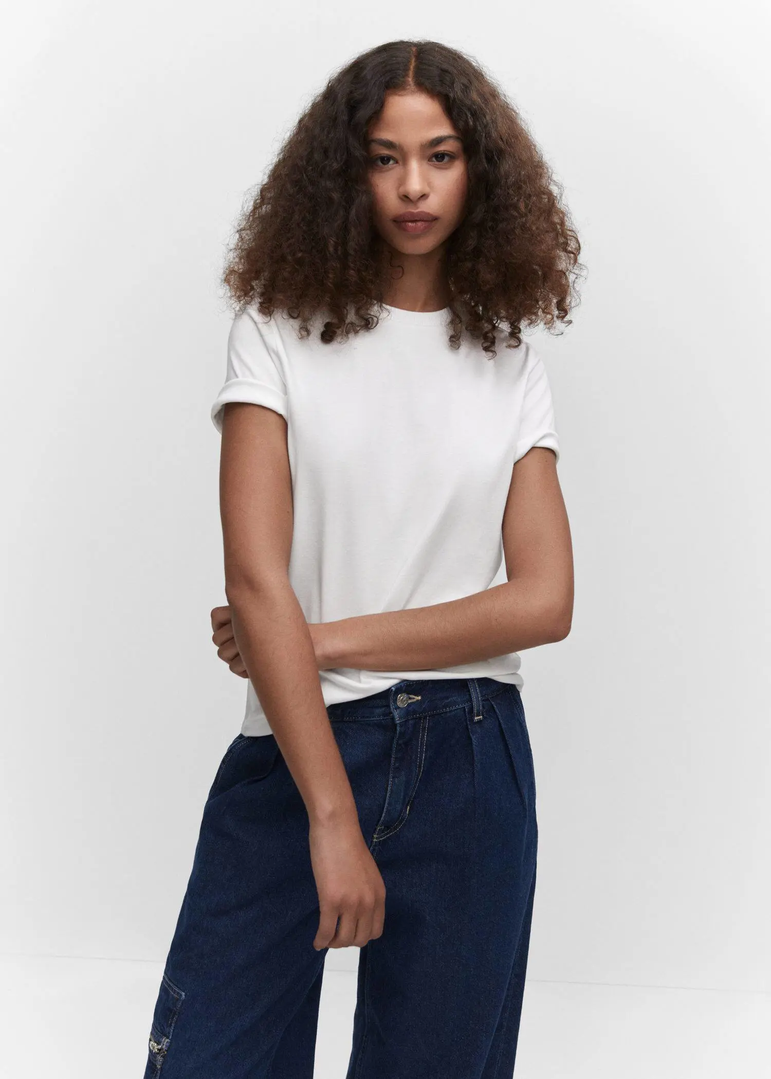 Mango Premium cotton t-shirt. a woman in white shirt and blue shorts. 