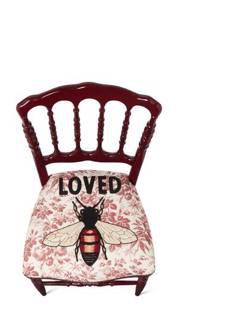 Wood chair with embroidered bee