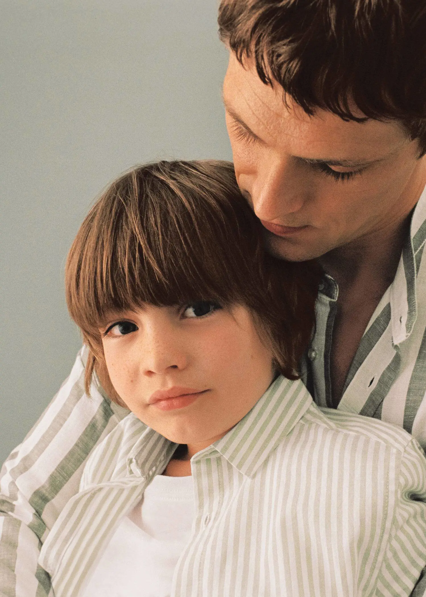 Mango KIDS/ Striped cotton dress shirt. a man and a child are looking at the camera. 