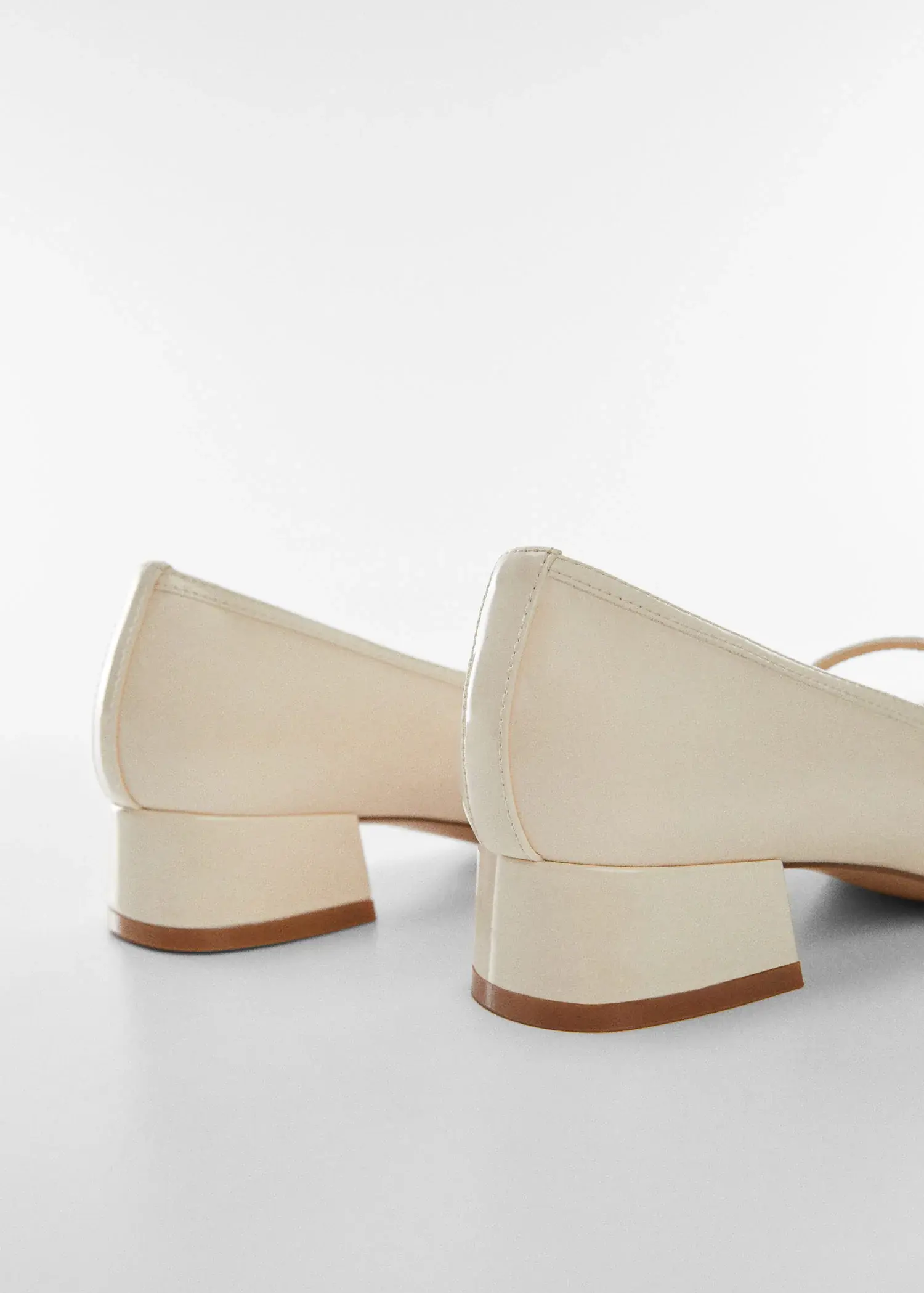 Mango Heeled shoes with buckle. a close up of a pair of shoes on a white surface 