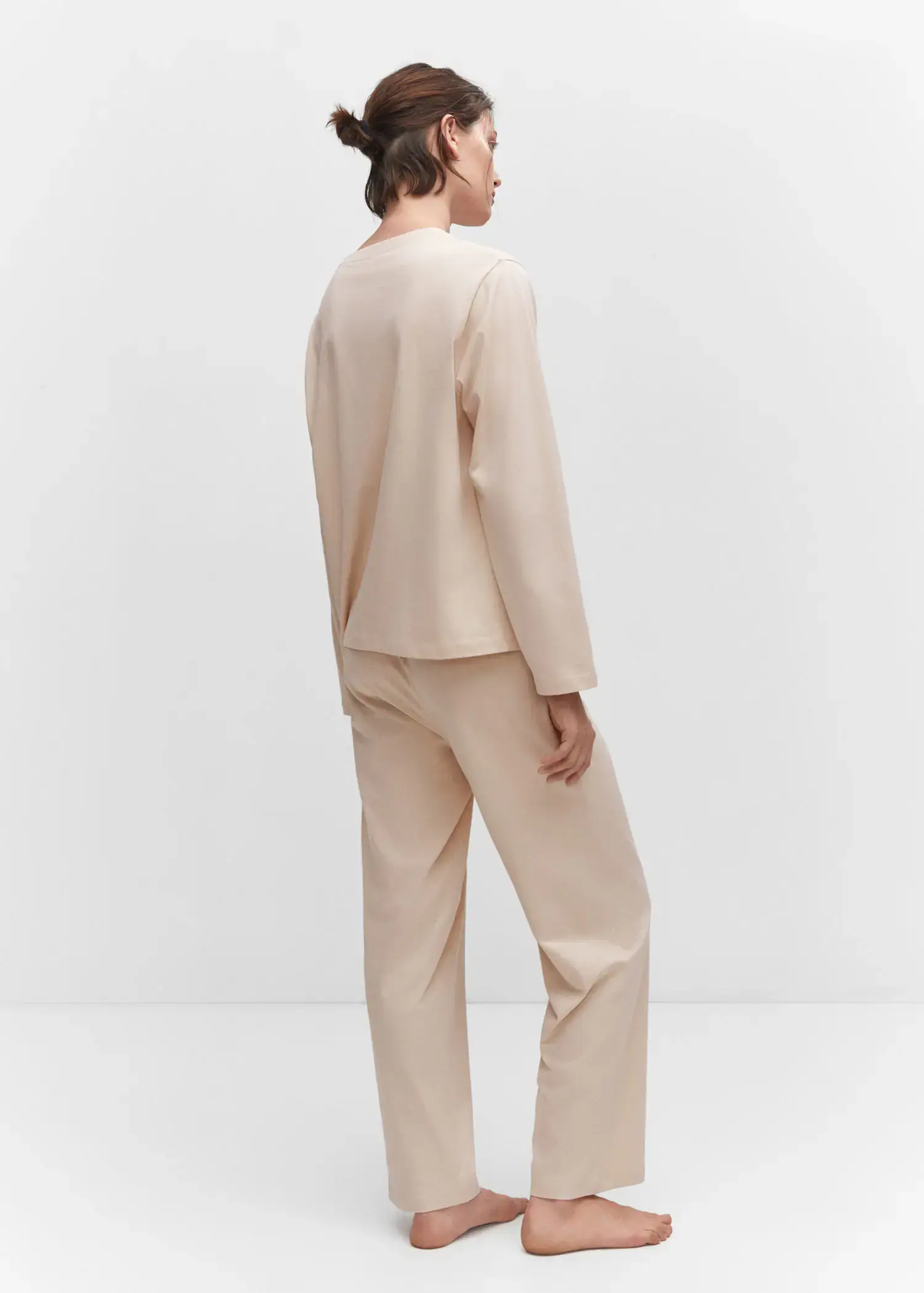 Mango Cotton long pyjamas. a person standing in a room wearing a suit. 