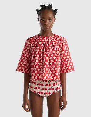 red blouse with pear pattern