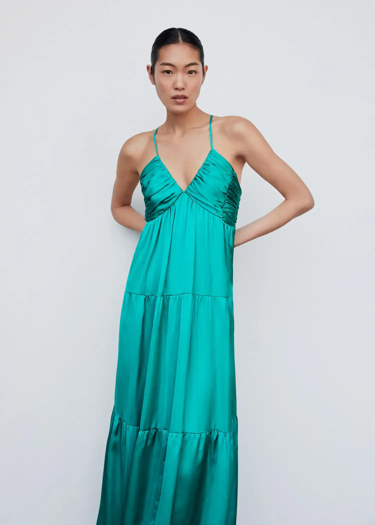 Mango Ruched satin dress. a woman wearing a long green dress posing for a picture. 