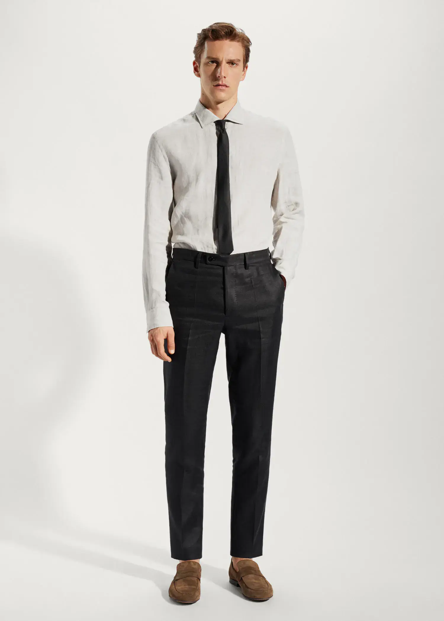 Mango 100% linen suit trousers. a man in a white shirt and black tie. 